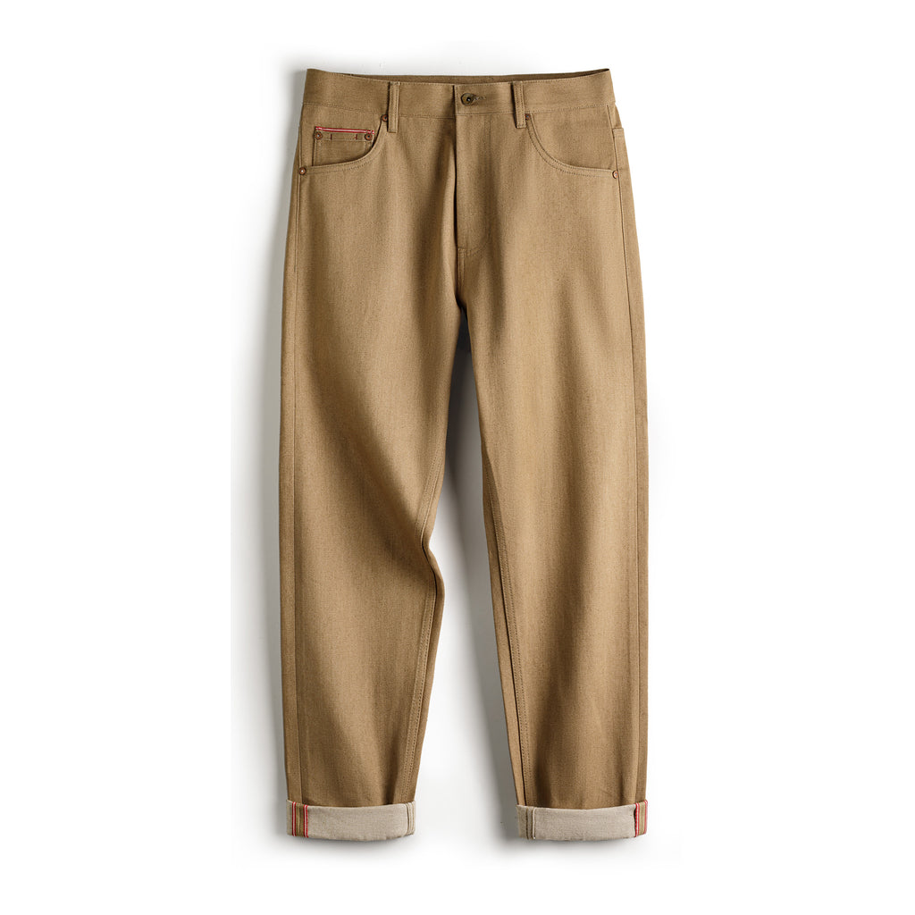 Beige pants on Meleche or Meléche (short as (Mé)) a white background
