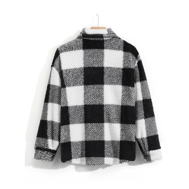 Black and white checkered shirt on a hanger against a white background