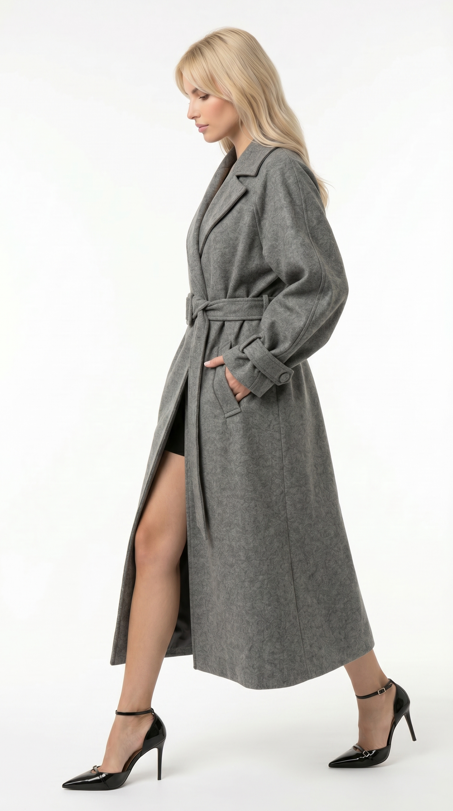 Woman wearing a long gray coat on a white background from Meleche USA or Meléche (short as (Mé))