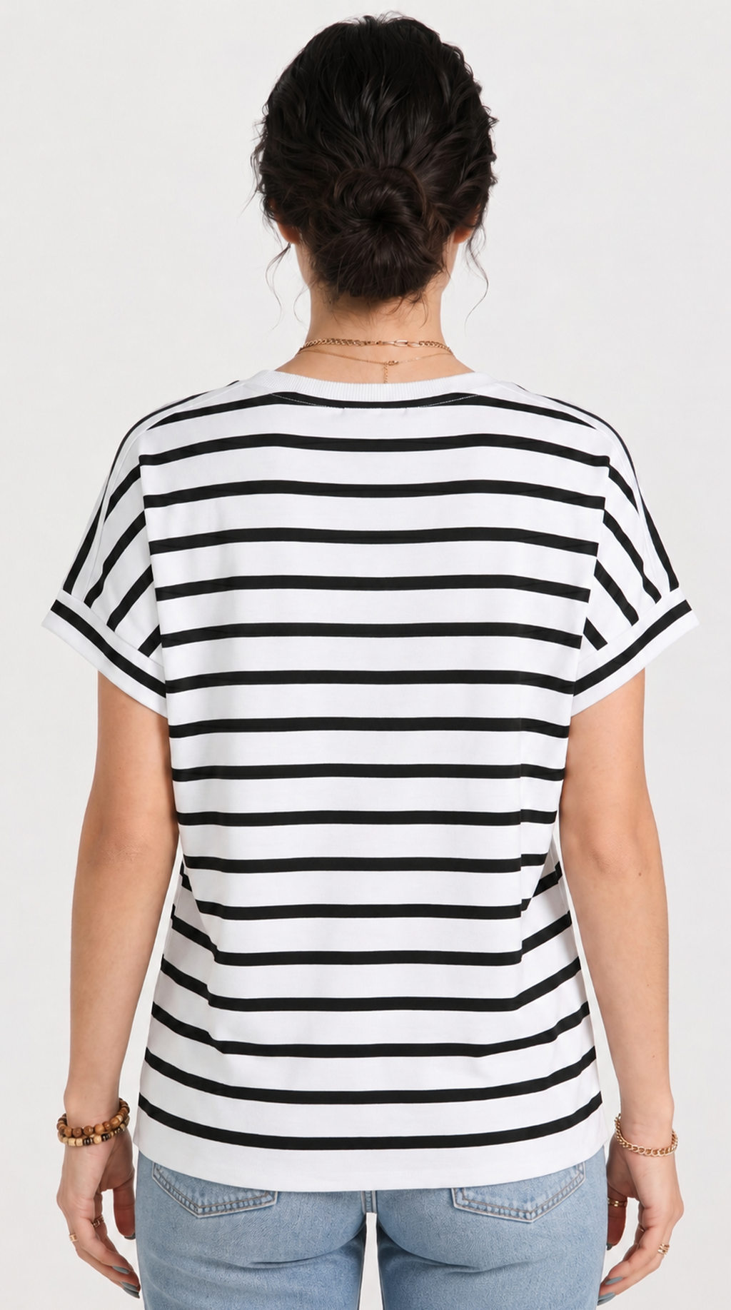 Person wearing a black and white striped t-shirt on a plain background, from Meleche Fashion USA or Meléche (short as (Mé))