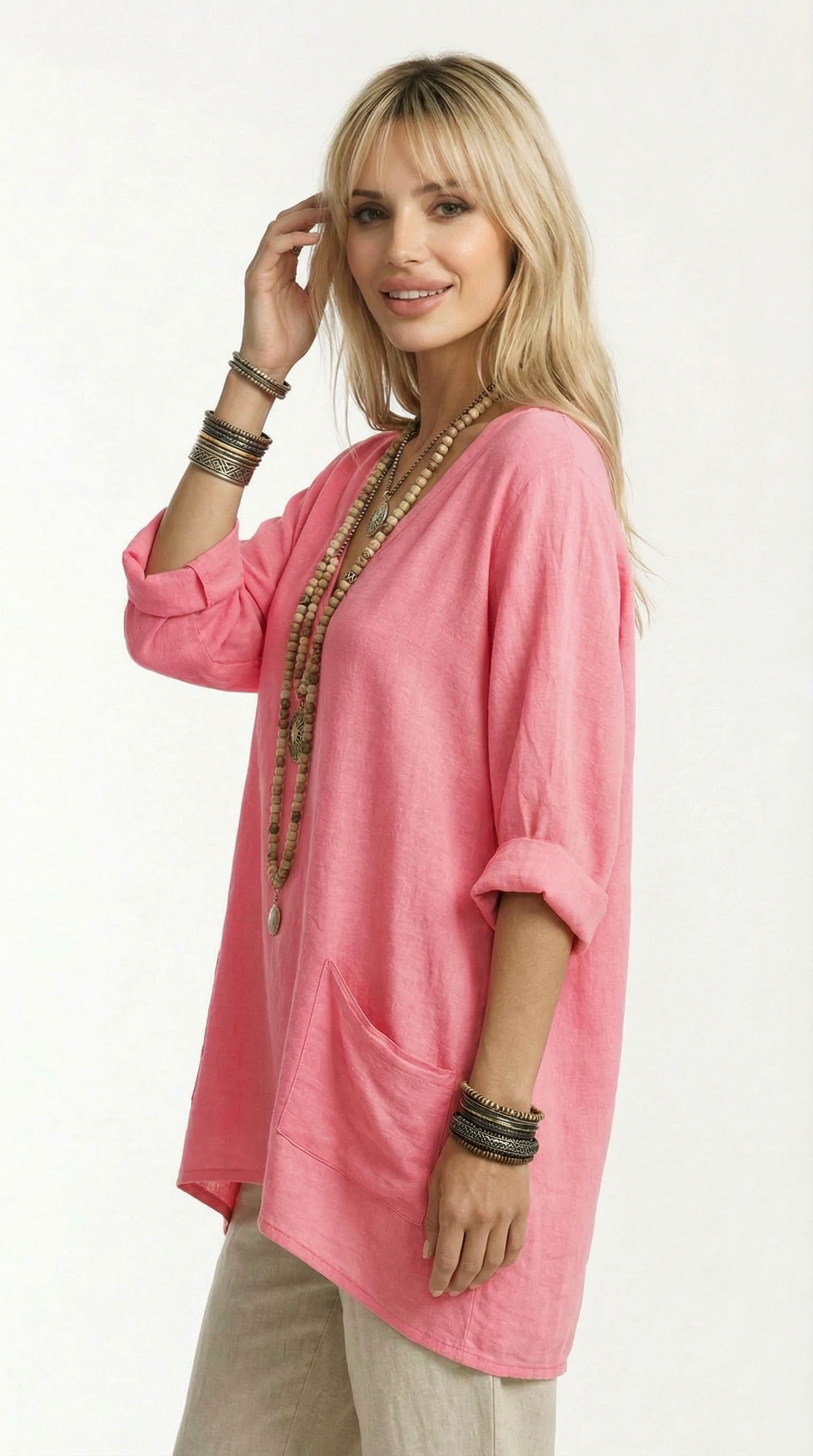 Woman wearing a pink oversized shirt with a white background from Meleche or Meléche (short as (Mé))