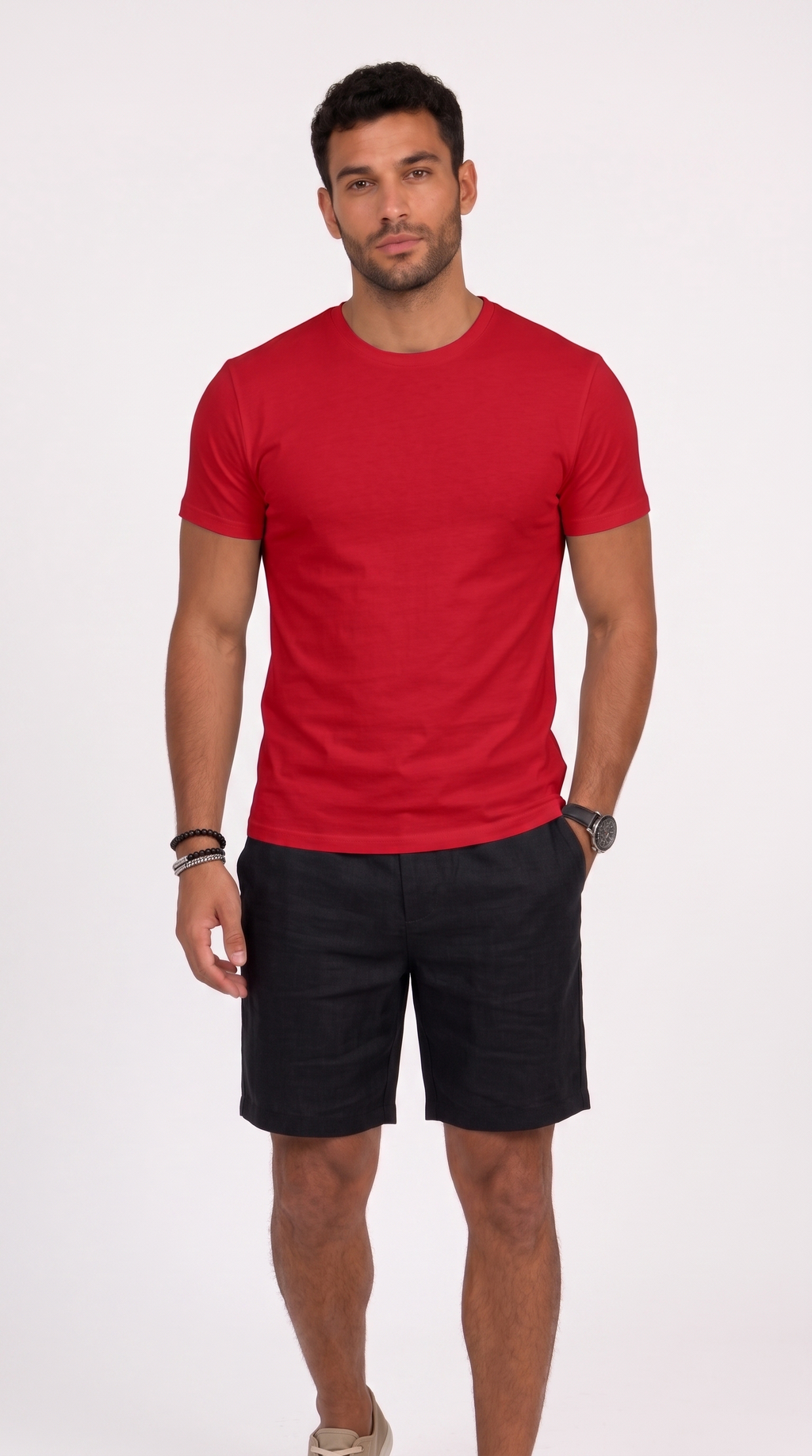 A man modeling a red short-sleeve crewneck t-shirt and black shorts against a plain white studio background, from Meleche Fashion USA or Meléche (short as (Mé))