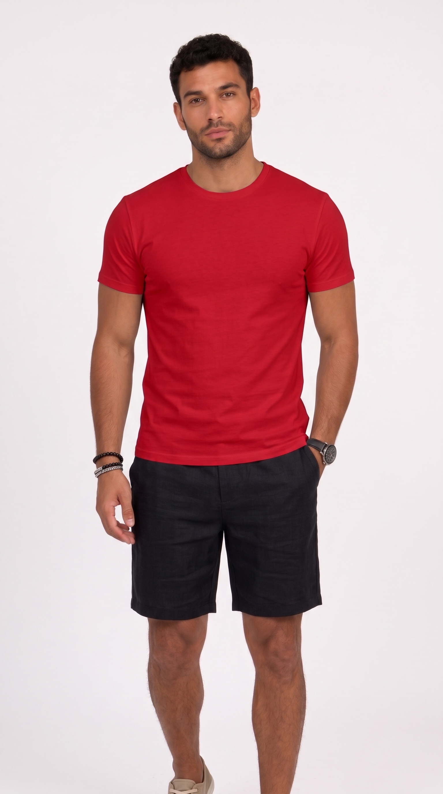 A man modeling a red short-sleeve crewneck t-shirt and black shorts against a plain white studio background, from Meleche Fashion USA or Meléche (short as (Mé))