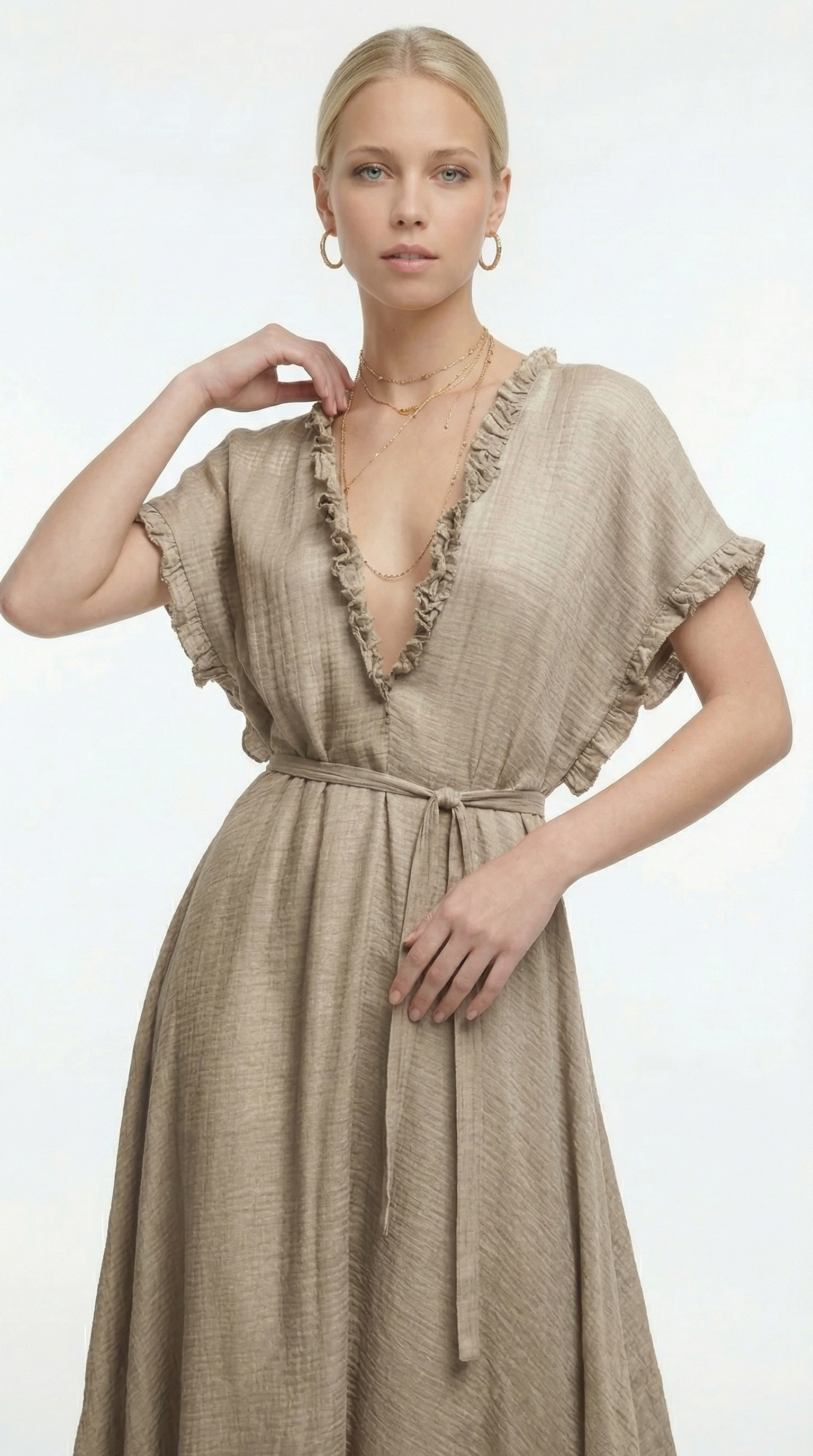 Woman wearing a black one-shoulder dress on a white background