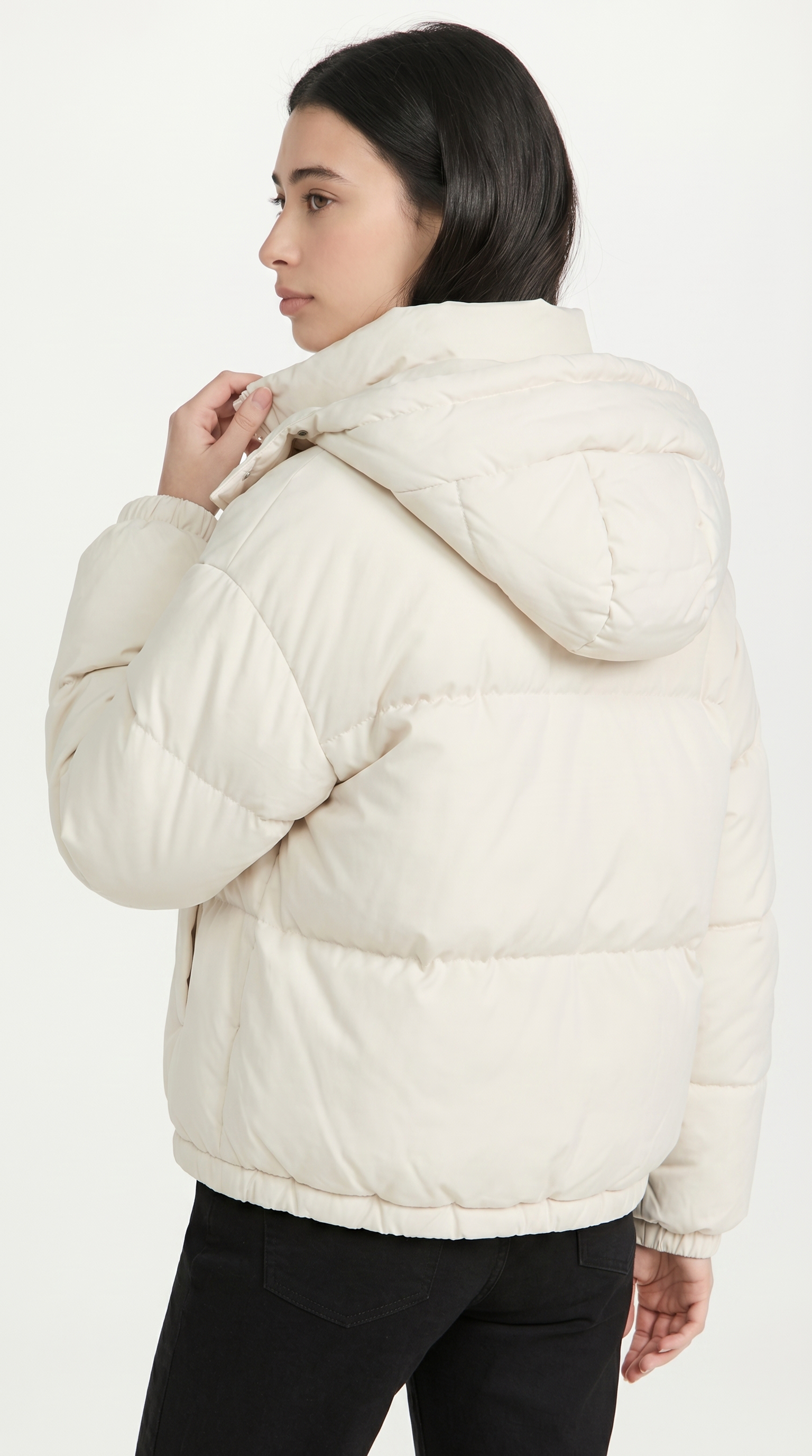 Woman wearing a white puffer jacket on a white background from Meleche or Meléche USA (short as (Mé))
