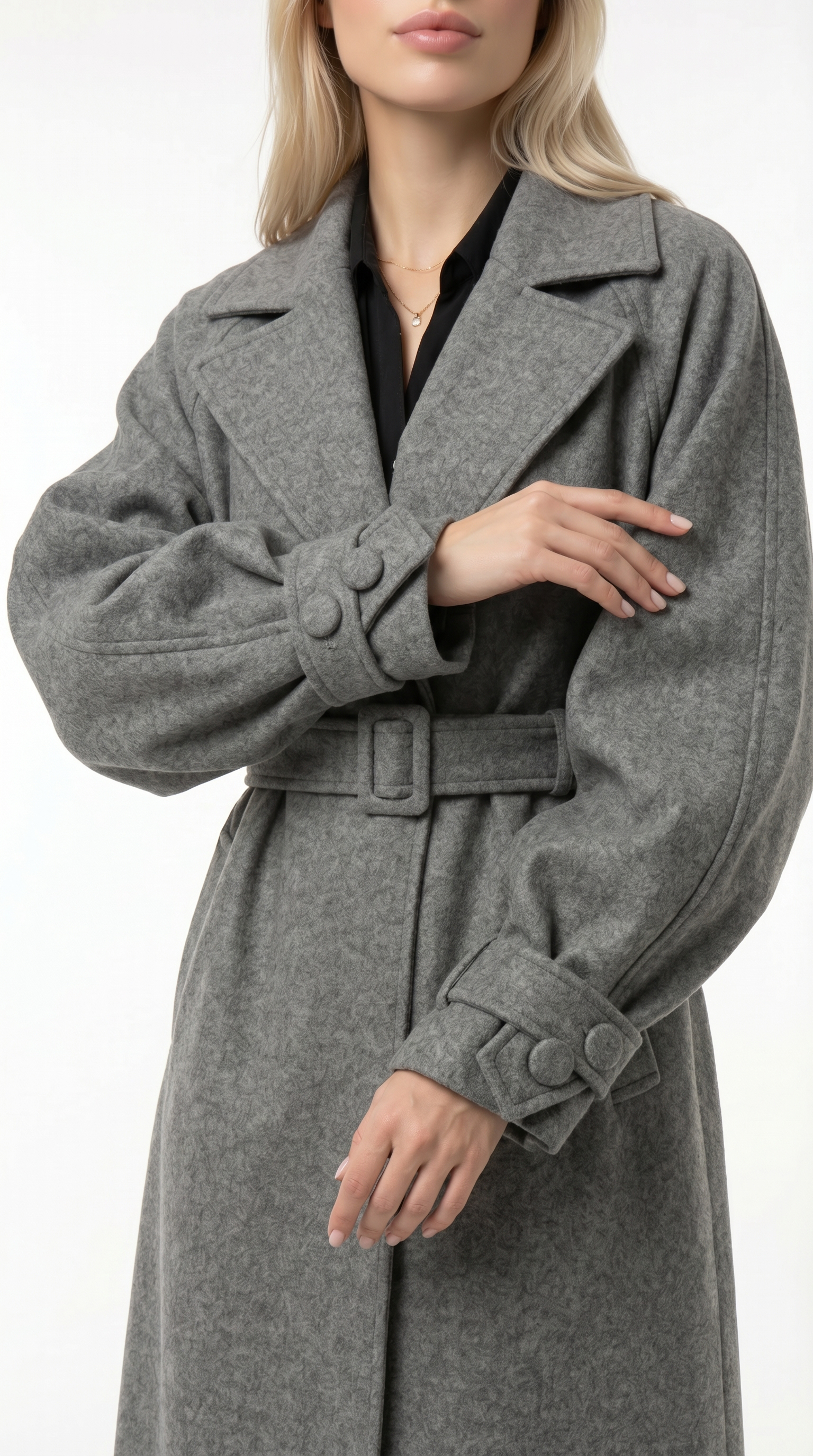 Woman wearing a gray turtleneck sweater and brown pants on a white background from Meleche USA or Meléche (short as (Mé))