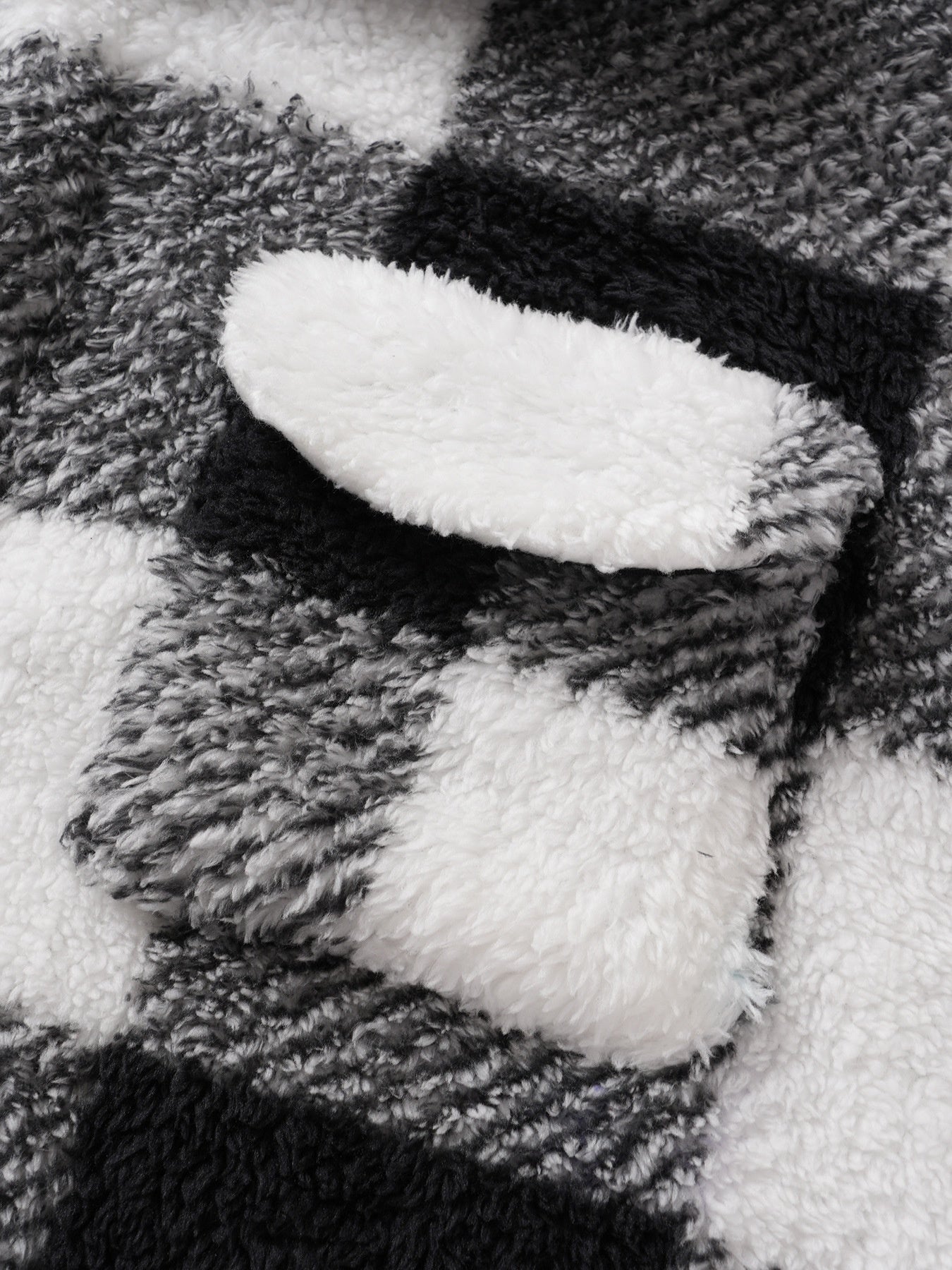 Close-up of a textured fabric with black and white pattern