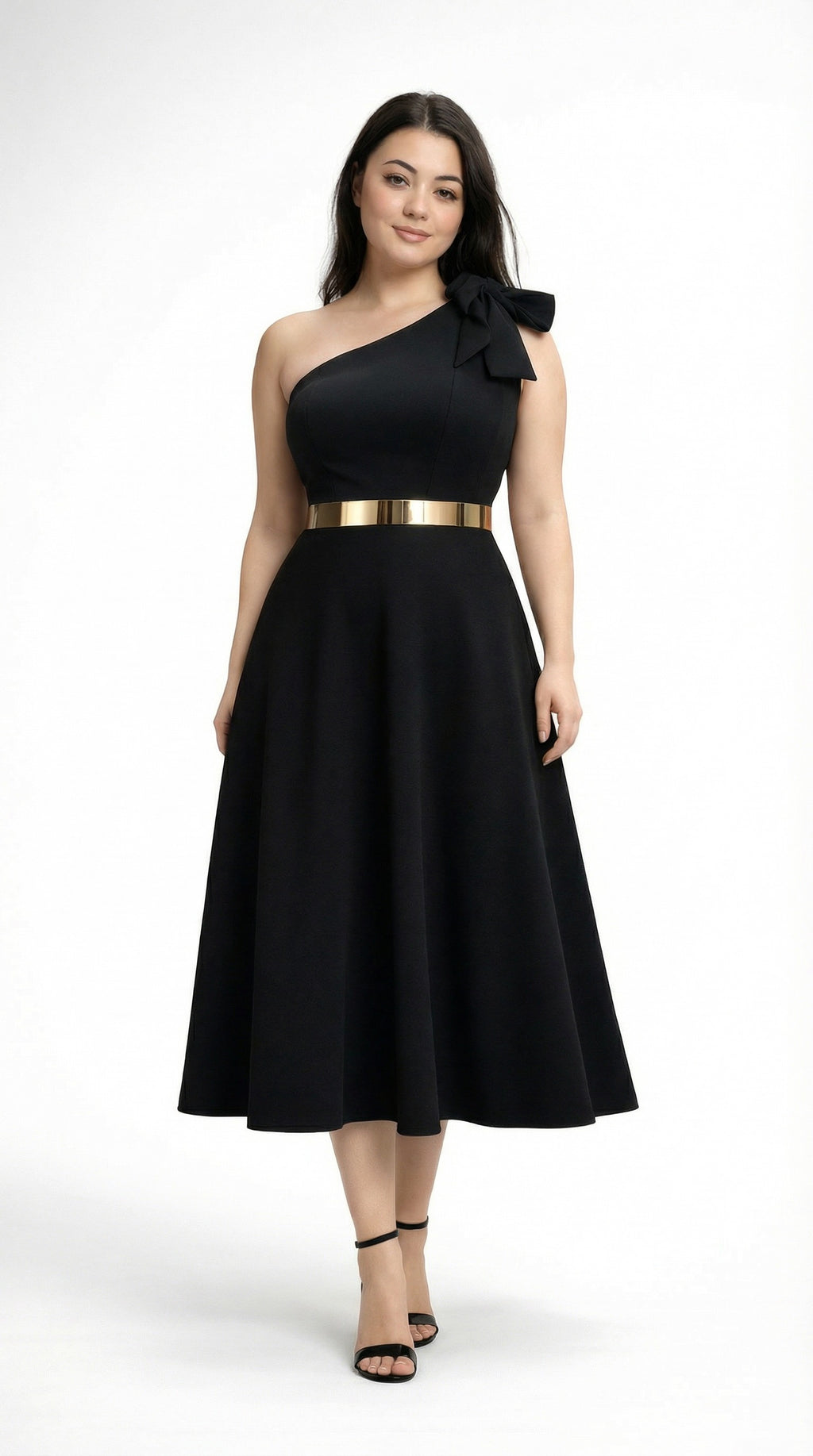Lou wearing a black one-shoulder dress with a gold belt from Meleche or Meléche (short as (Mé)) on a white background in Mé Studio