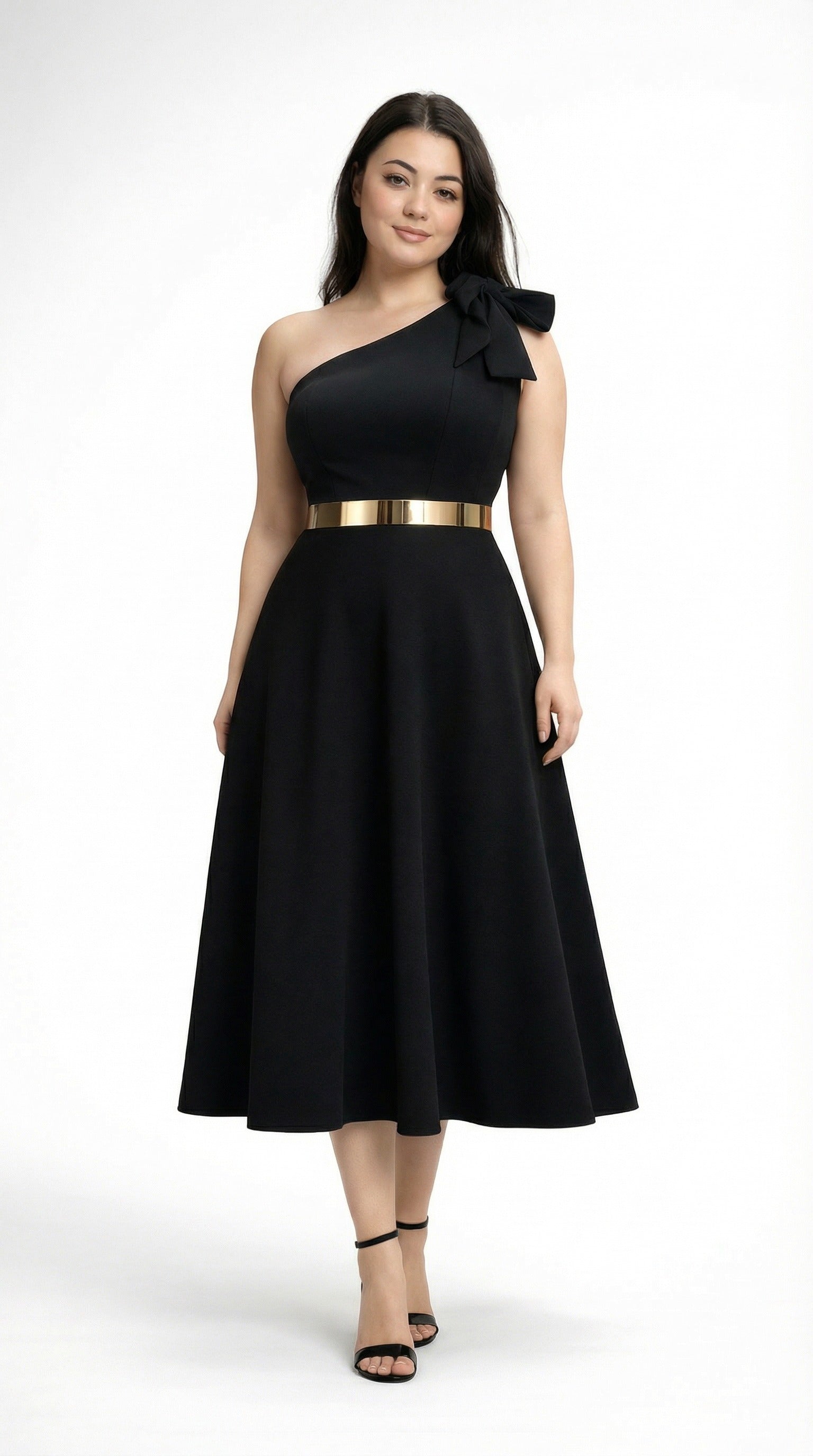 Lou wearing a black one-shoulder dress with a gold belt from Meleche or Meléche (short as (Mé)) on a white background in Mé Studio