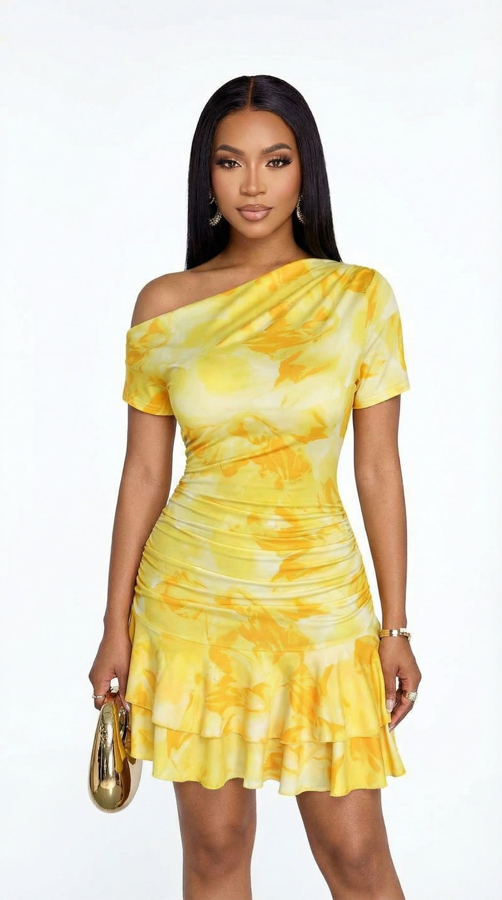 Woman wearing a yellow tie-dye dress on a white background