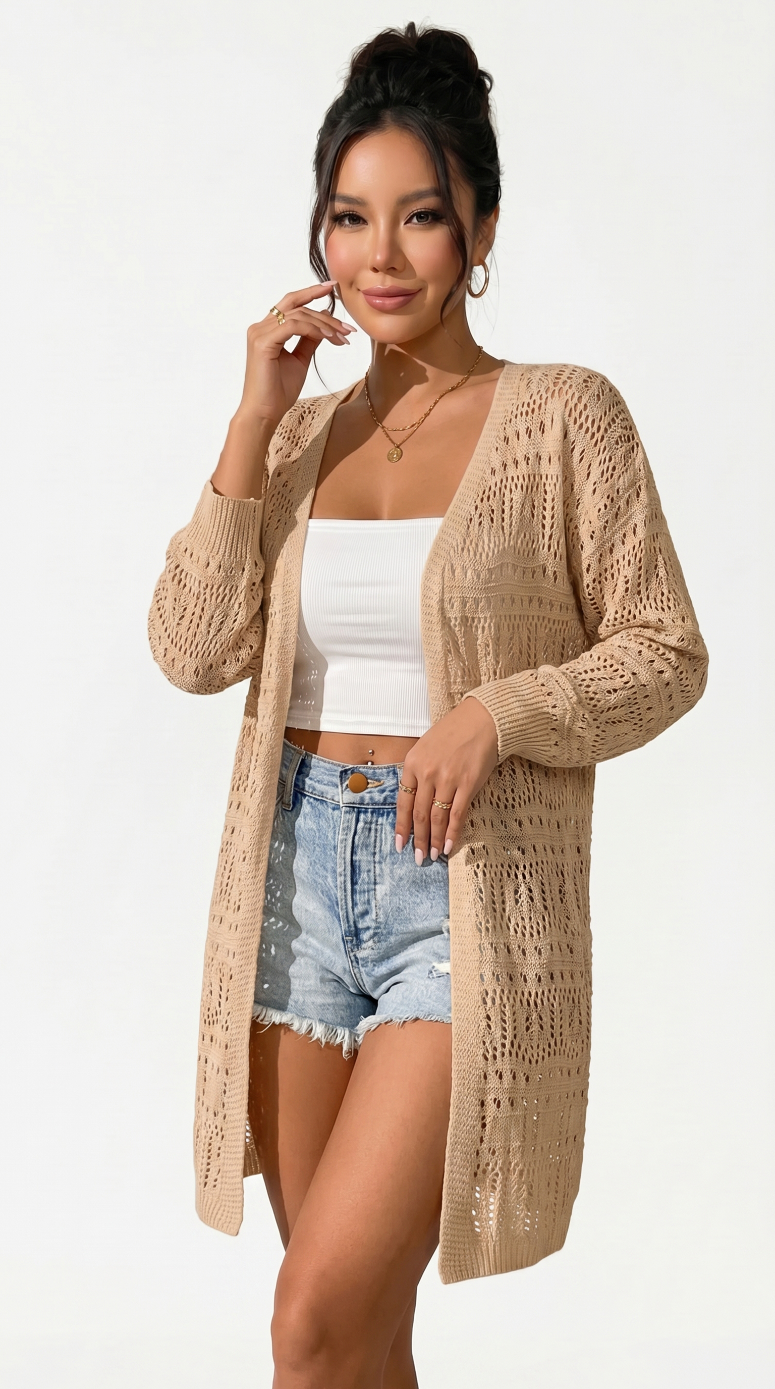 Woman wearing a beige crochet cardigan over a white top and denim shorts on a white background from Meleche or Meléche (short as (Mé))