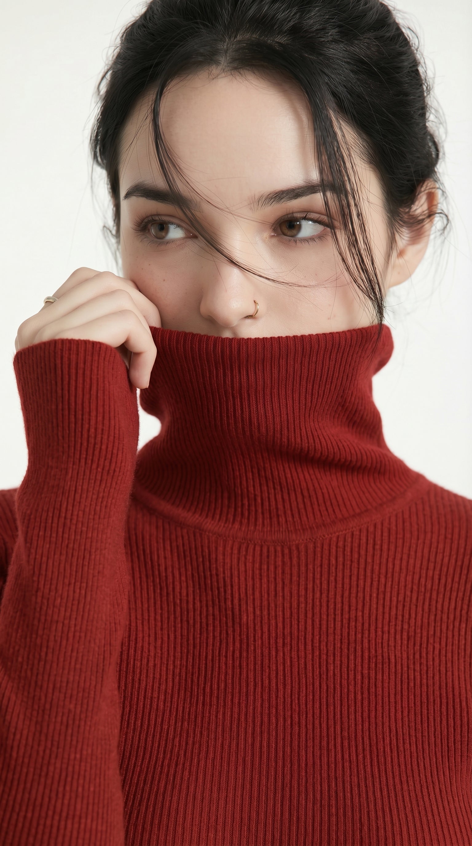 Woman wearing a red turtleneck sweater against a white background from Meleche USA or Meléche (short as (Mé))