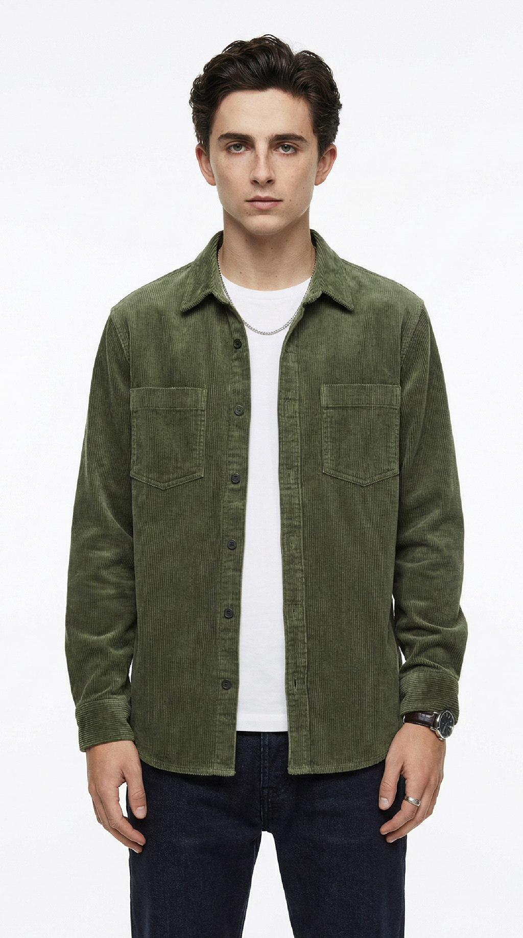 Man wearing a green jacket over a white shirt on a white background