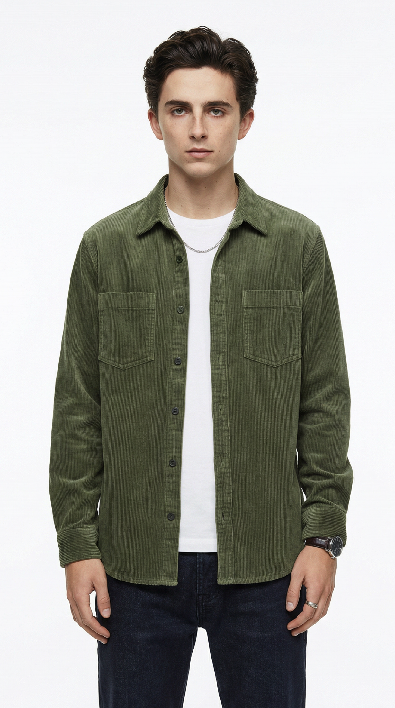 Man wearing a green jacket over a white shirt on a white background