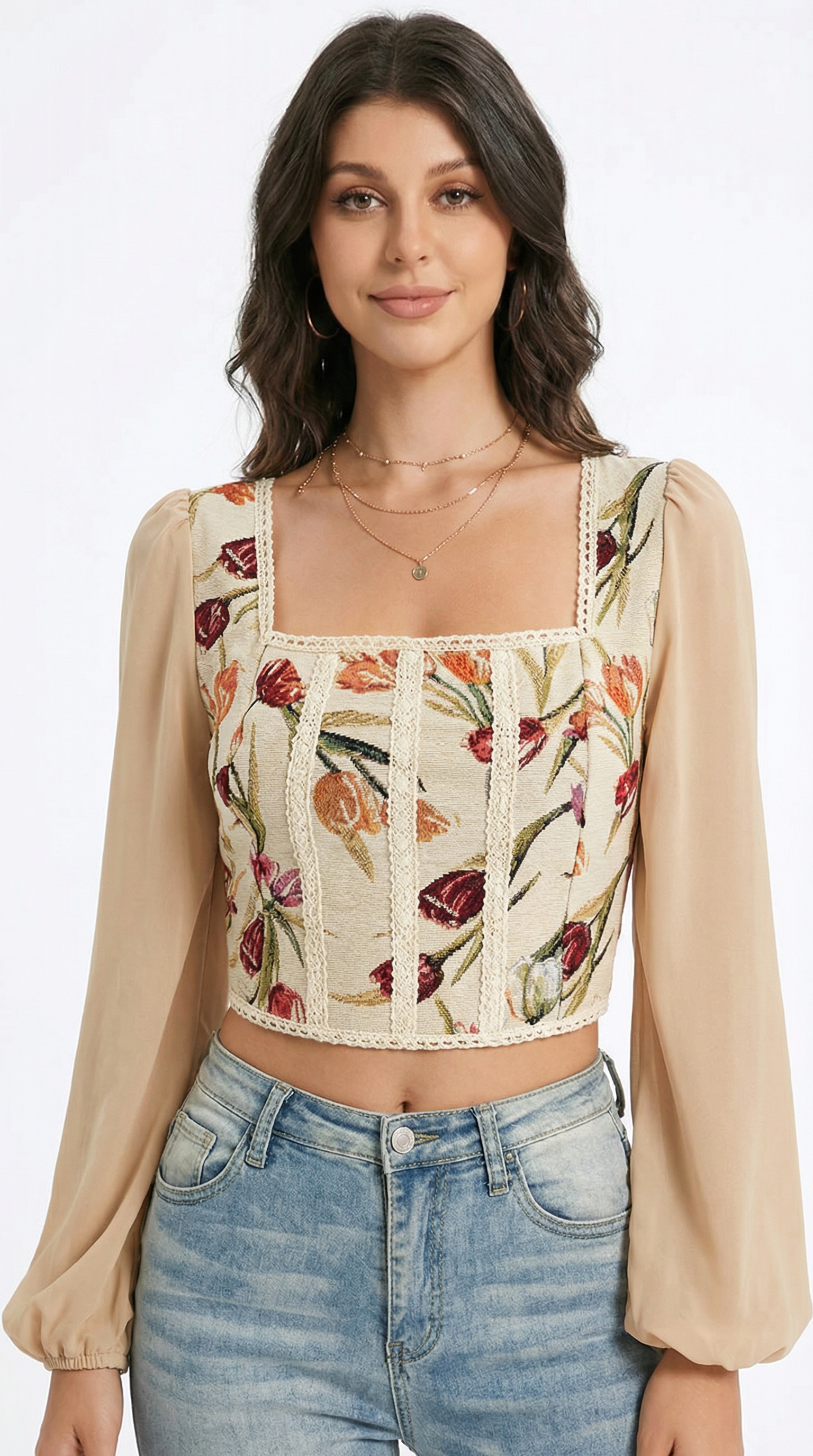 Woman wearing a floral top with sheer sleeves on a white background from Meleche or Meléche (short as (Mé))