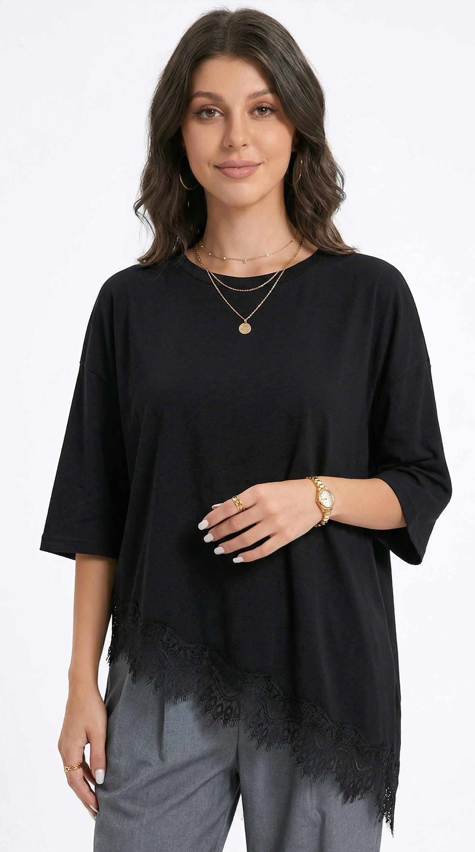 Woman wearing a black top with fringe details on a white background, from Meleche Fashion USA or Meléche (short as (Mé))