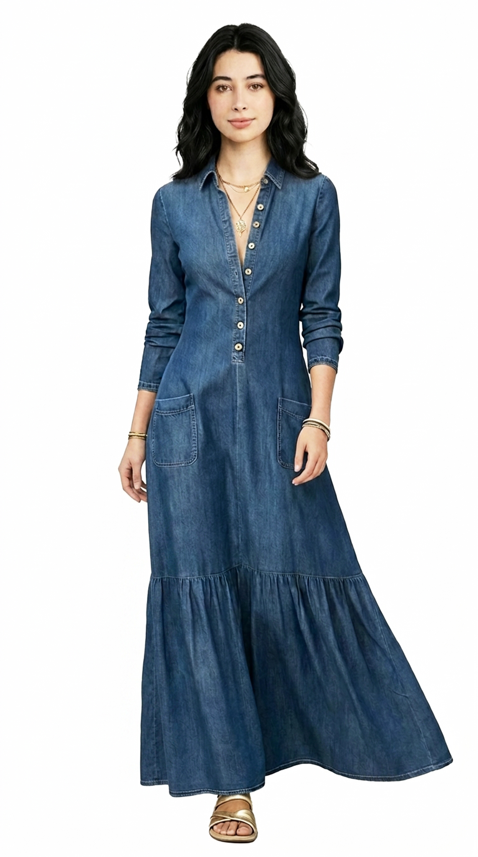 Woman wearing a long denim dress on a white background