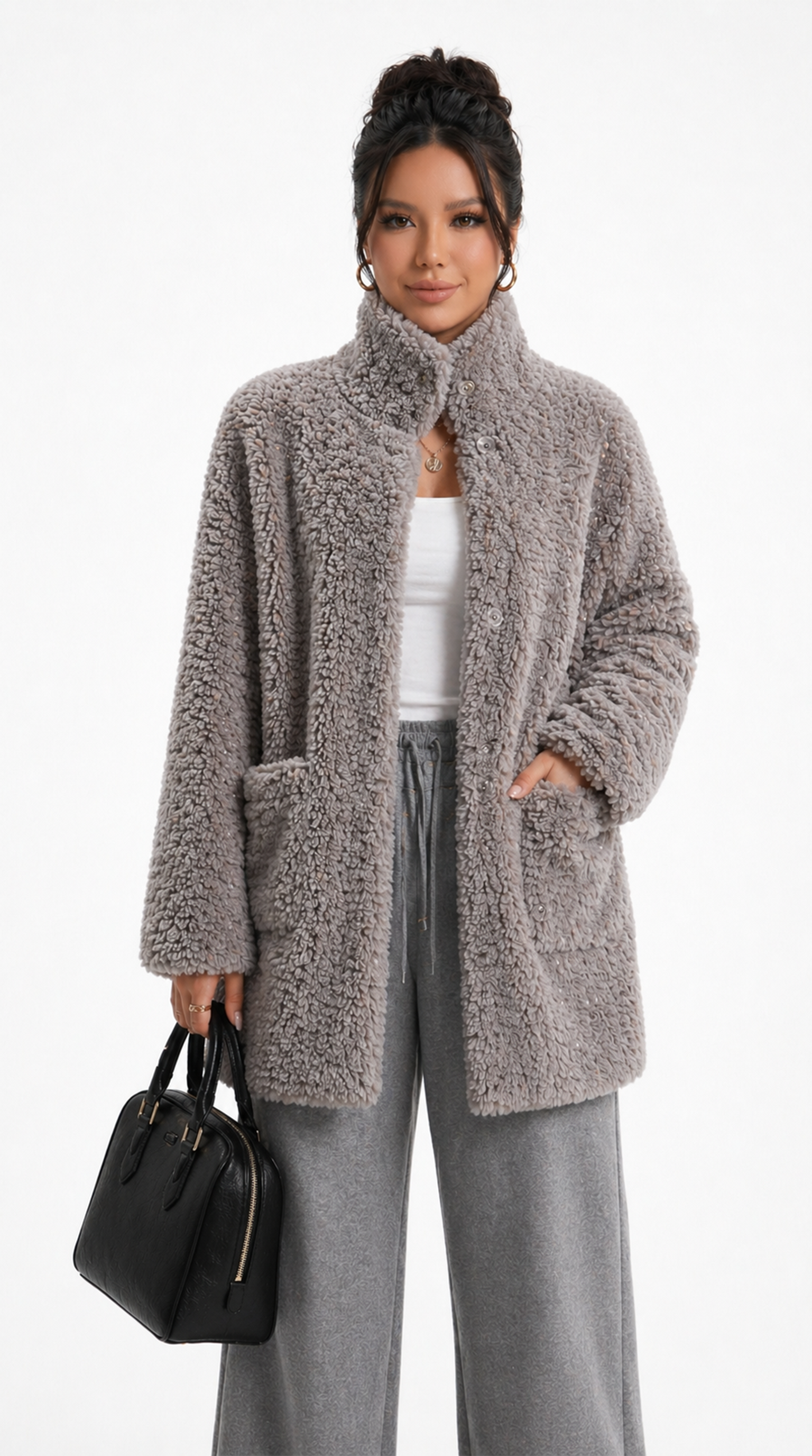 Woman wearing a fluffy beige coat with gray pants and holding a black handbag on a white background from Meleche Fashion USA or Meléche (short as (Mé))