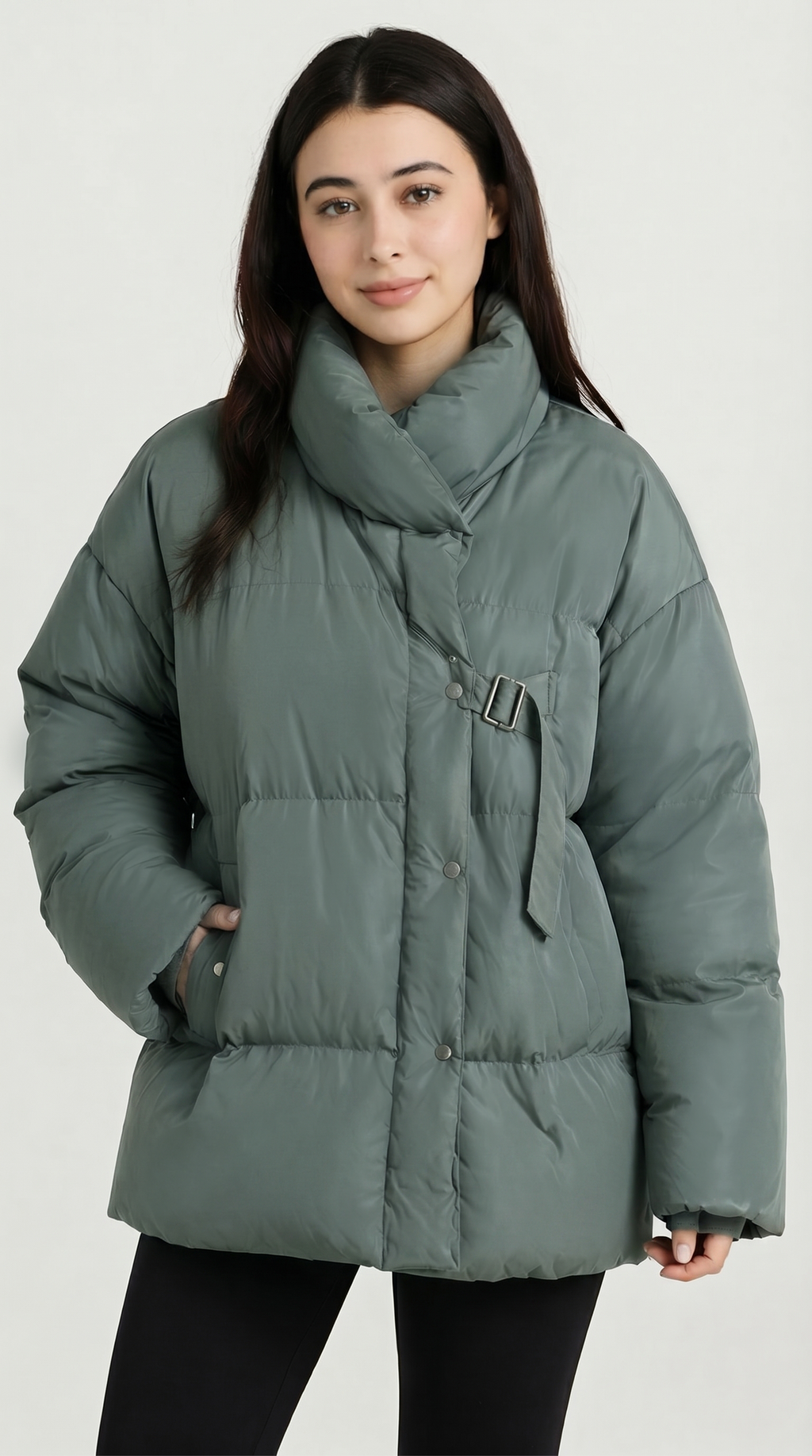 Person wearing a green puffer jacket on a white background from Meleche USA or Meléche (short as (Mé))