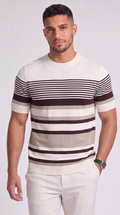 A man wearing a short-sleeve crewneck knit sweater with horizontal stripes in cream, beige, and dark brown, paired with cream pants, against a light gray studio background, from Meleche Fashion USA or Meléche (short as (Mé))