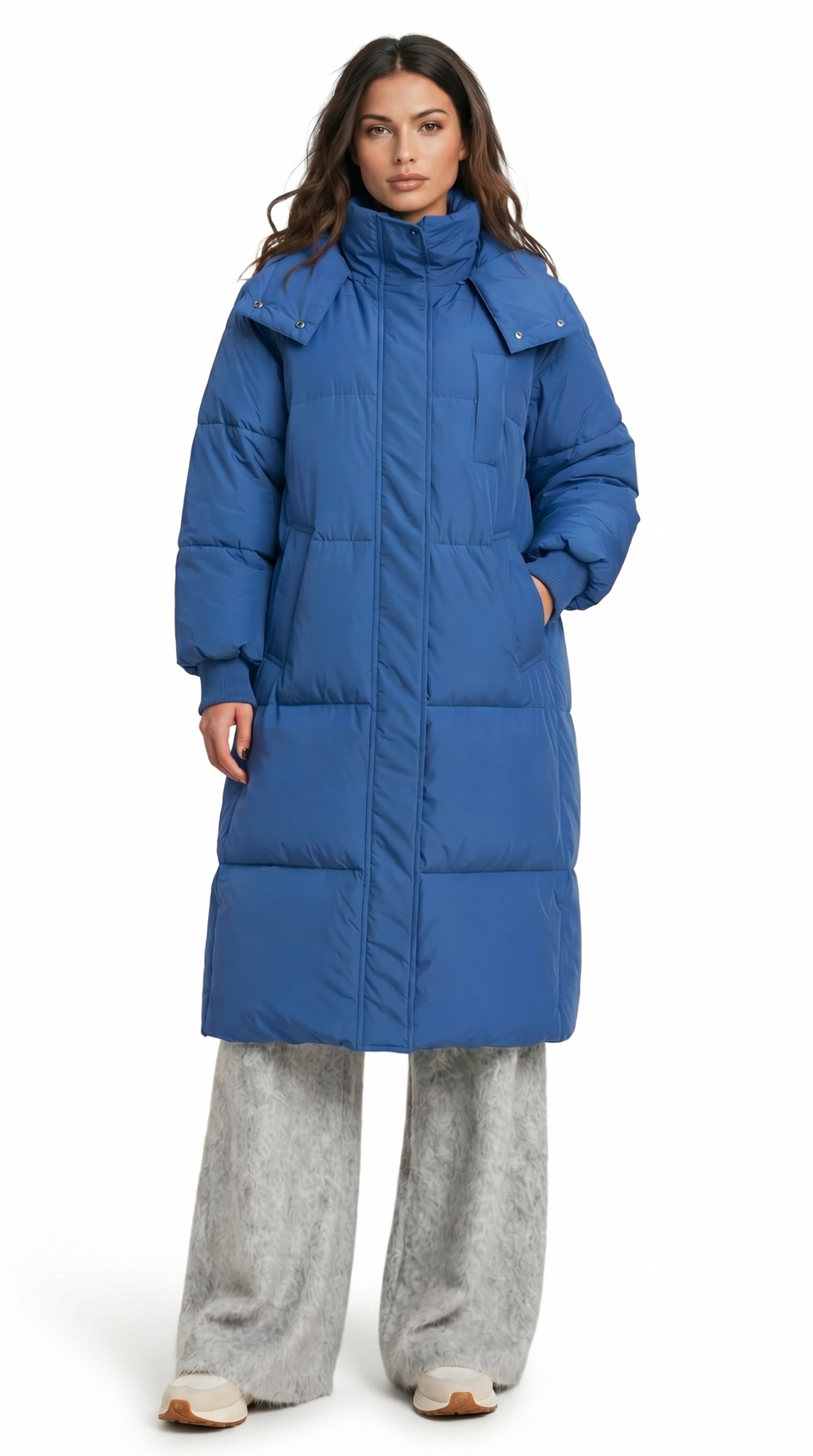 Woman wearing a blue puffer coat on a white background from Meleche Fashion USA or Meléche (short as (Mé))