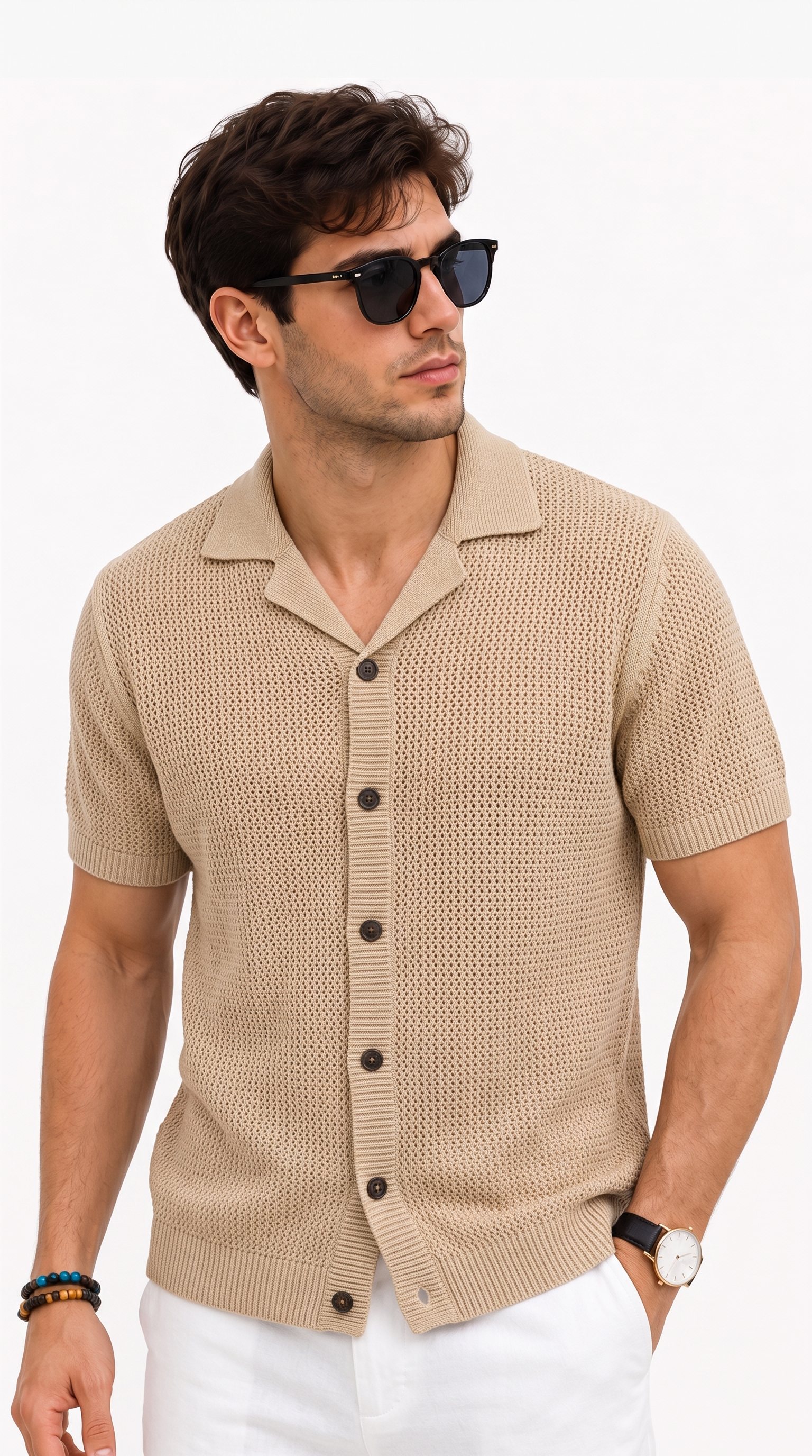 A man wearing a beige short-sleeve knit button-up shirt with a camp collar, paired with white pants and black sunglasses, photographed against a clean white studio background, from Meleche Fashion USA or Meléche (short as (Mé))