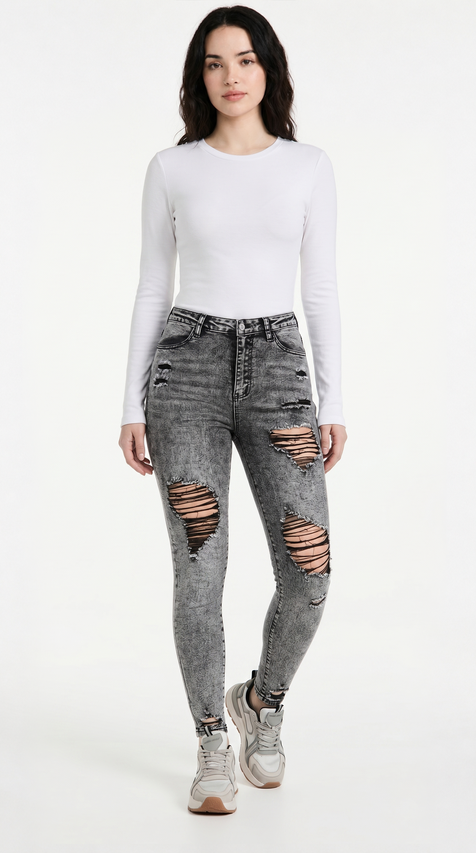 Woman wearing a white long-sleeve top and gray ripped jeans on a white background,  slim fit Skinny jeans from Meleche Fashion USA or Meléche (short as (Mé))