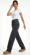 Woman wearing black jeans and a white top on a white background, Relaxed Fit cotton jeans from Meleche Fashion USA or Meléche (short as (Mé))