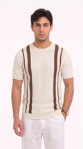 A man wearing a cream-colored short-sleeve knit sweater with brown vertical stripe details, paired with white trousers, standing against a plain white studio background, from Meleche Fashion USA or Meléche (short as (Mé))