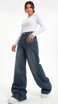 Woman wearing wide-leg jeans and a white top on a white background, wide jeans from Meleche Fashion USA or Meléche (short as (Mé))
