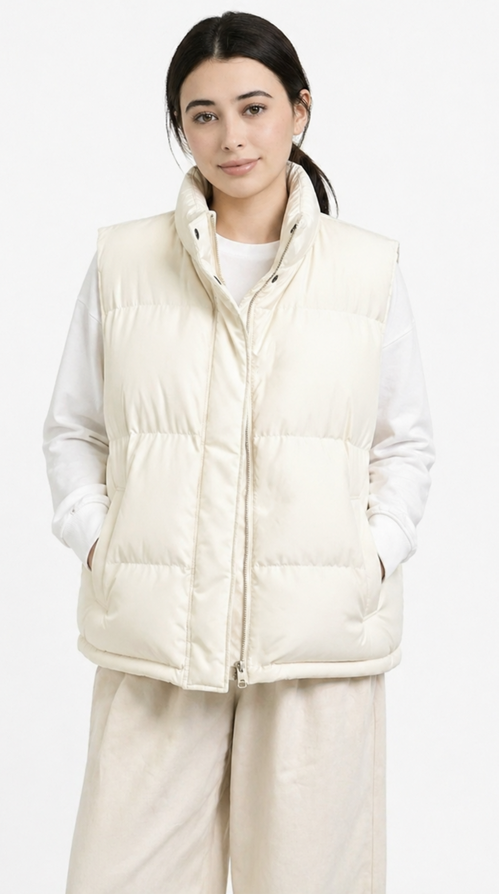 Woman wearing a cream-colored puffer vest against a white background from Meleche Fashion USA or Meléche (short as (Mé))