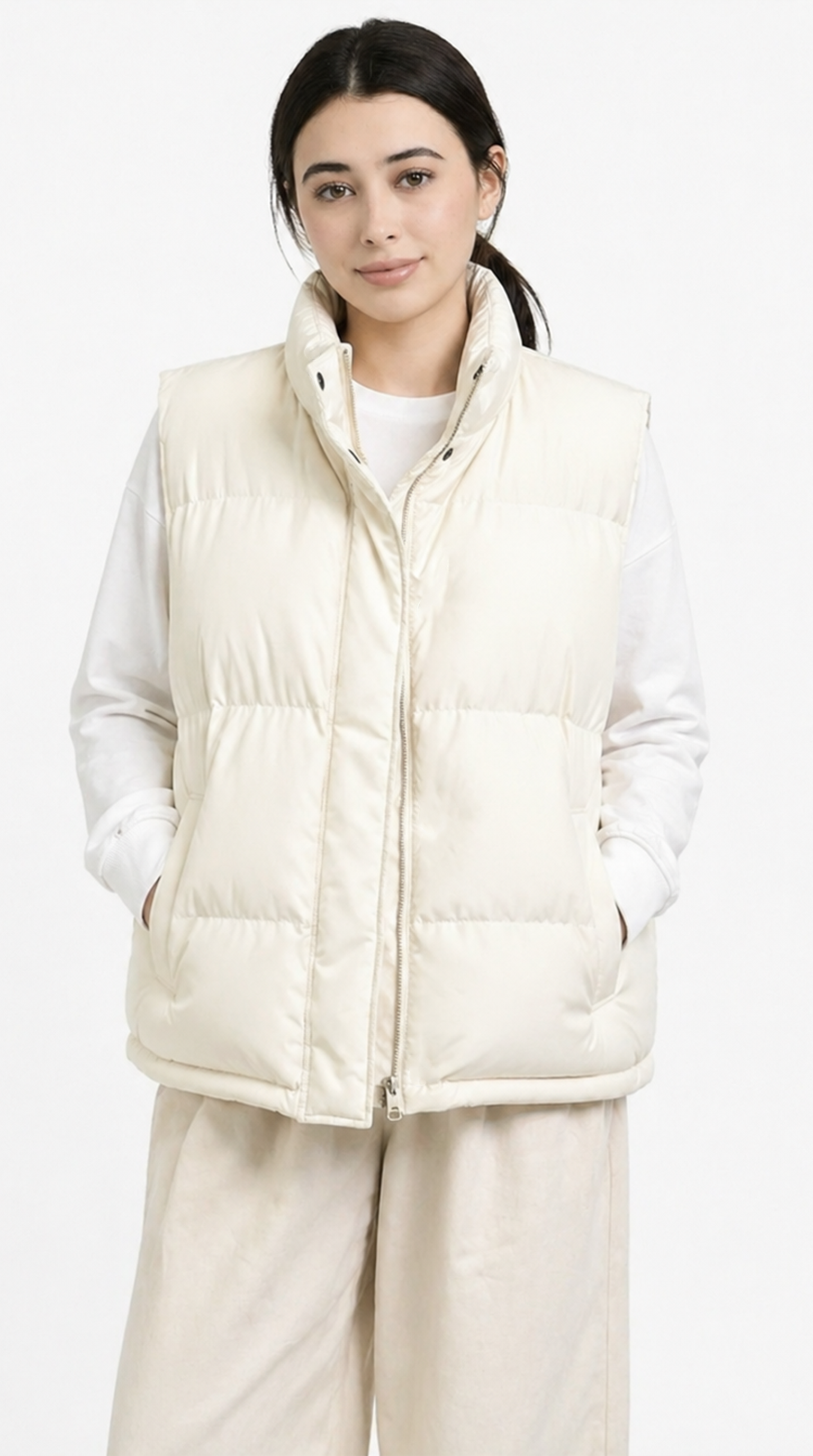 Woman wearing a cream-colored puffer vest against a white background from Meleche Fashion USA or Meléche (short as (Mé))