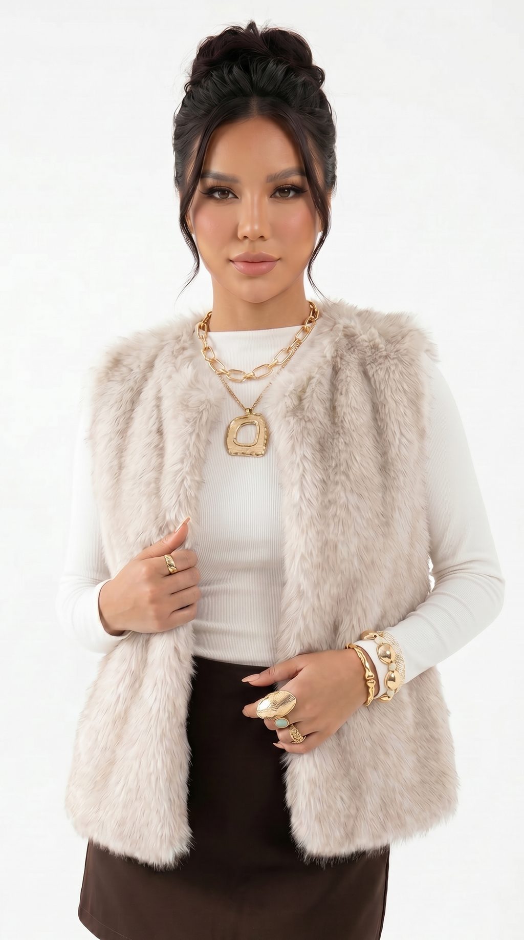 Woman wearing a beige fur vest over a white top on a white background from Meleche Fashion USA or Meléche (short as (Mé))