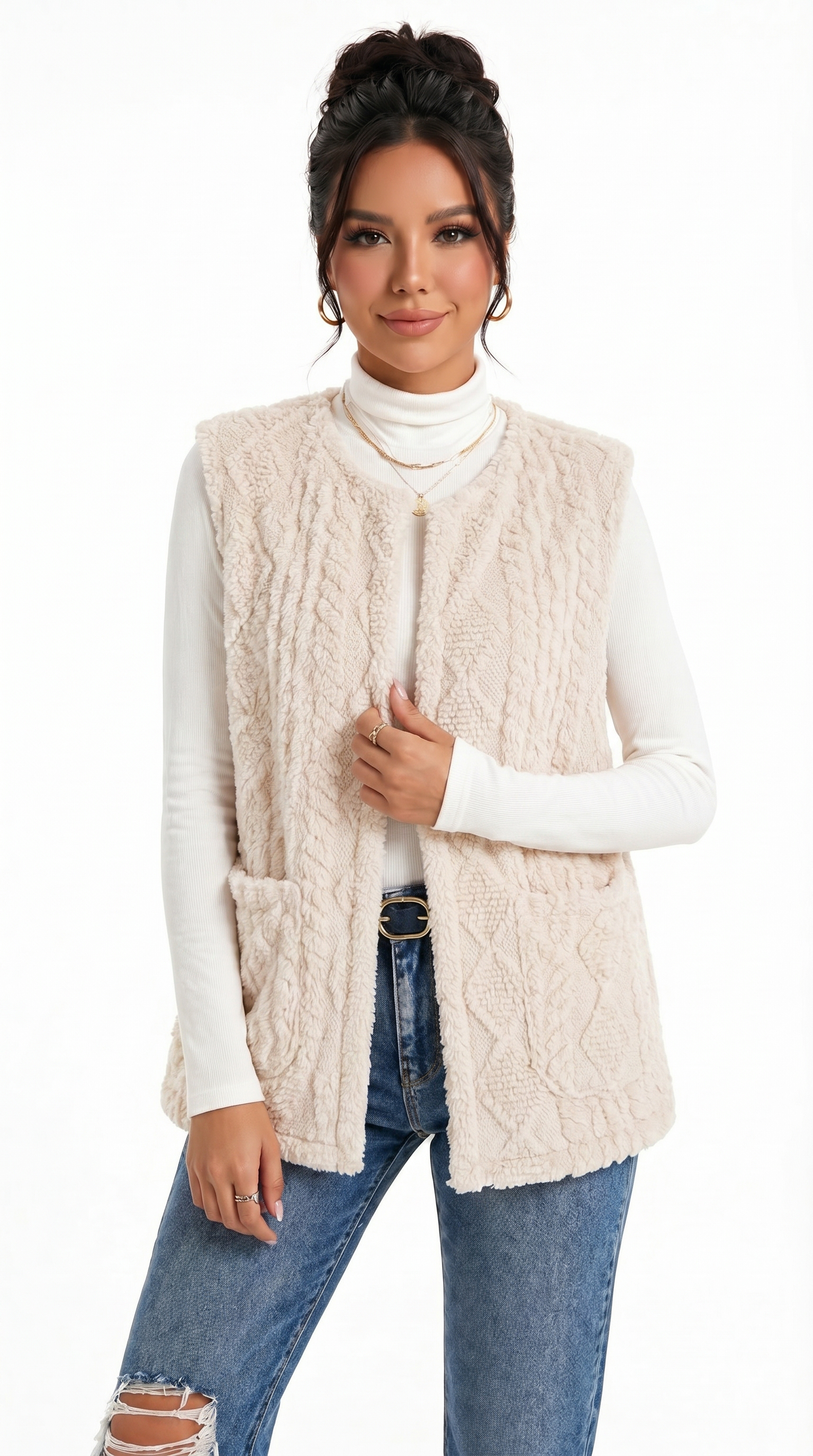 Woman wearing a cream cable knit vest over a white turtleneck and blue jeans on a white background from Meleche Fashion USA or Meléche (short as (Mé))