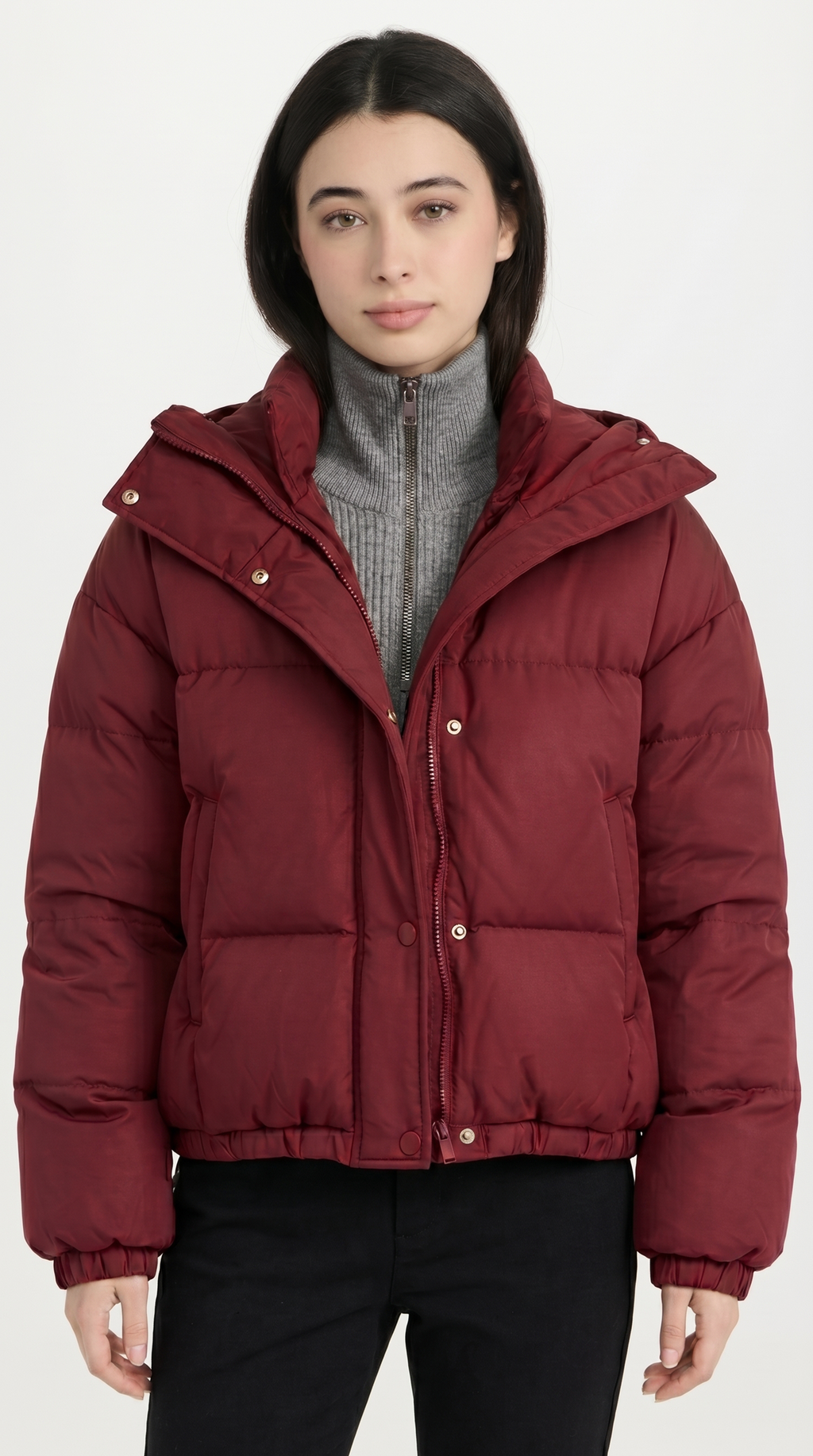 Person wearing a red puffer jacket on a white background from Meleche USA or Meléche (short as (Mé))
