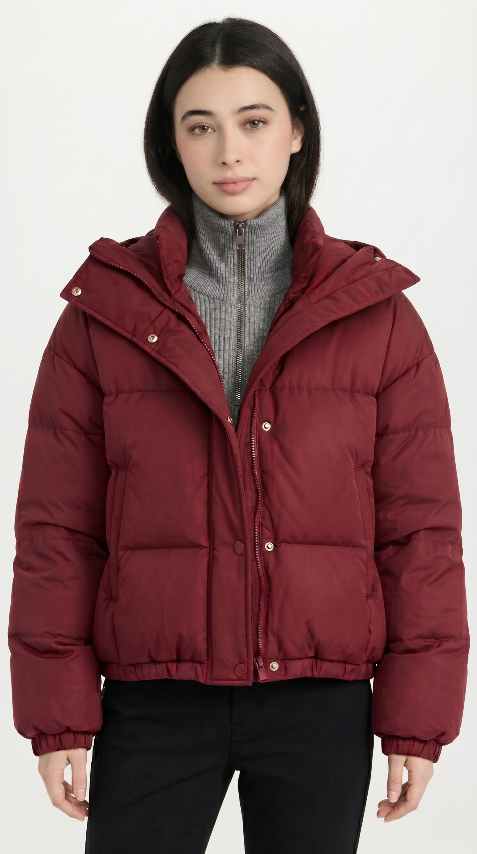 Person wearing a red puffer jacket on a white background from Meleche USA or Meléche (short as (Mé))