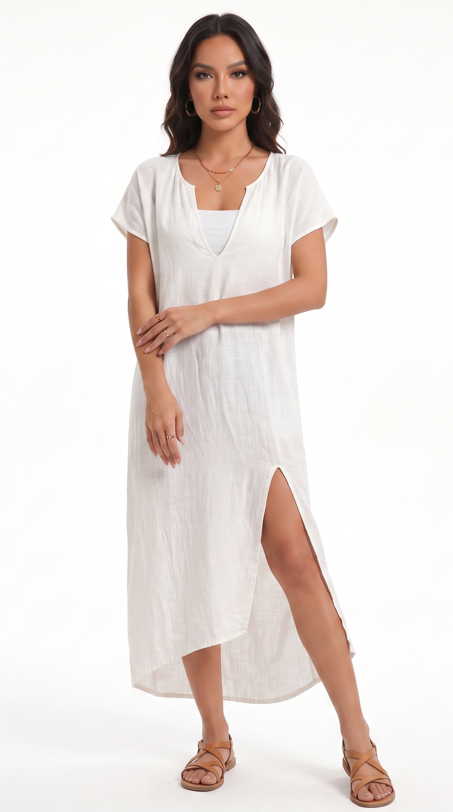Woman wearing a white dress with a slit on a white background