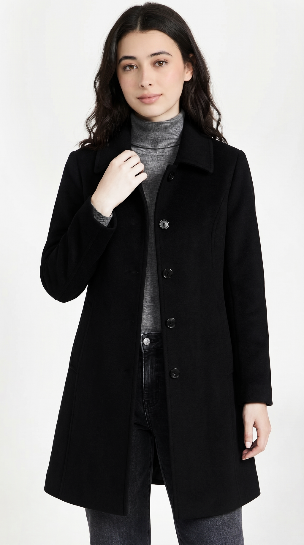 Woman wearing a black coat on a white background from Meleche USA or Meléche (short as (Mé))