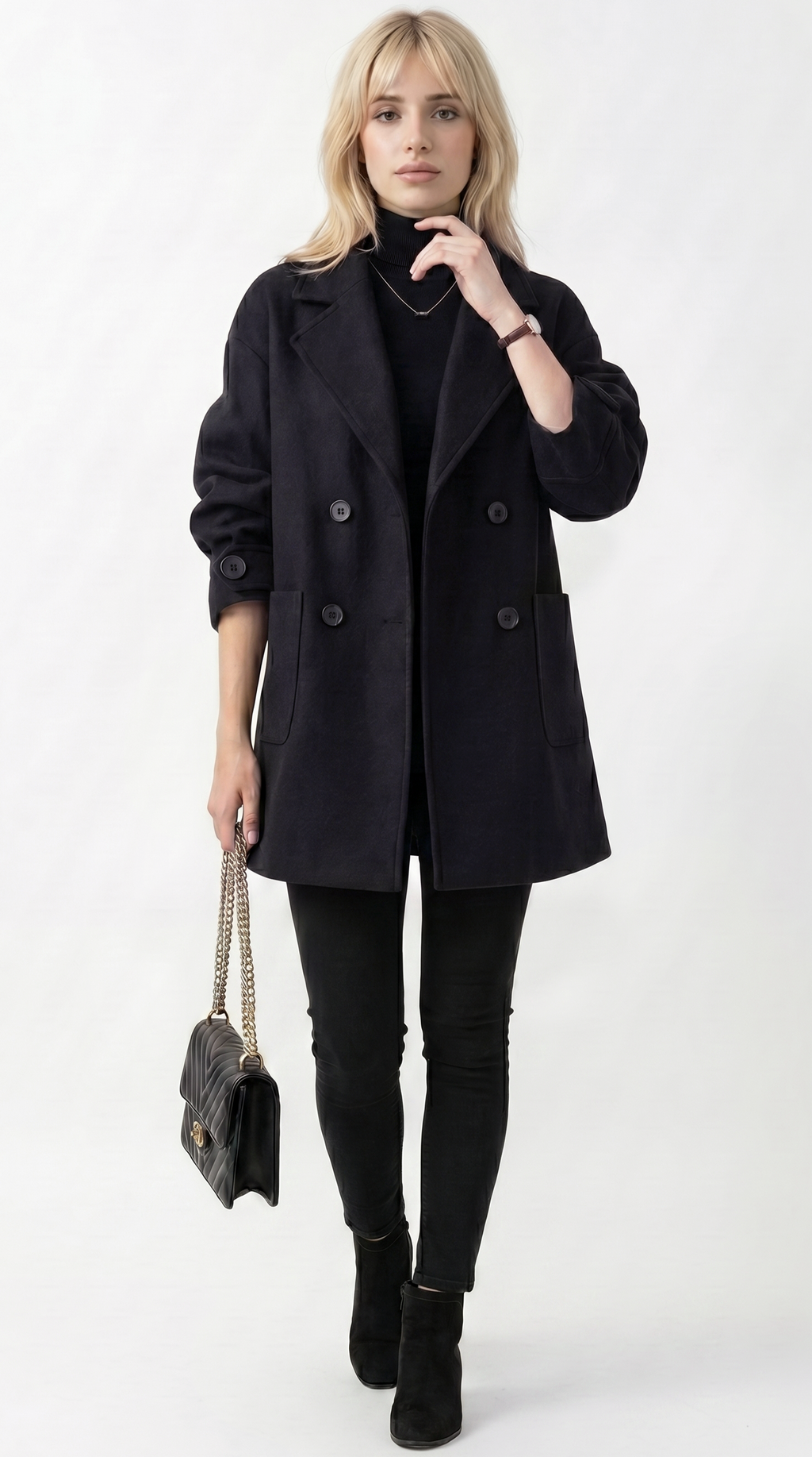 Woman wearing a black coat, black turtleneck, black pants, and black boots on a white background from Meleche or Meléche USA (short as (Mé))