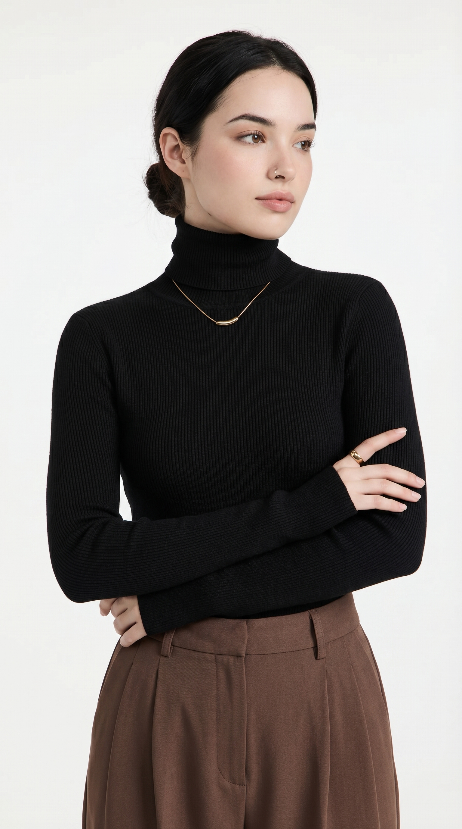 Woman wearing a black turtleneck sweater and brown pants on a white background from Meleche or Meléche USA (short as (Mé))