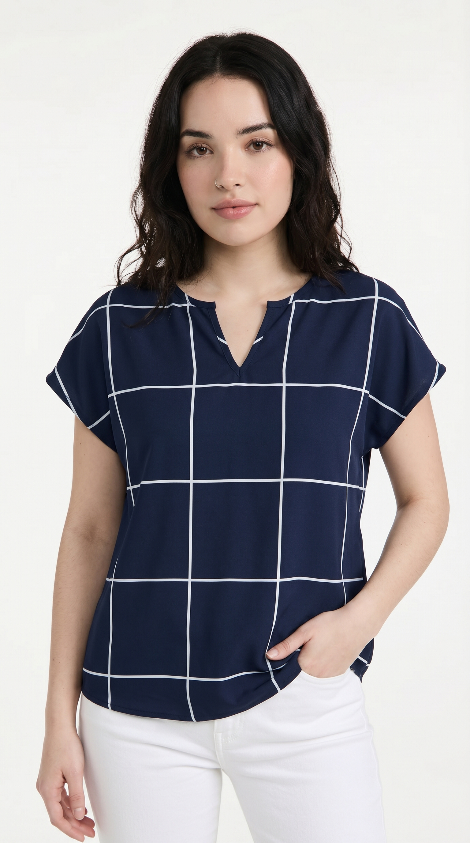 Woman wearing a navy blue checkered blouse with white pants on a white background, from Meleche Fashion USA or Meléche (short as (Mé))