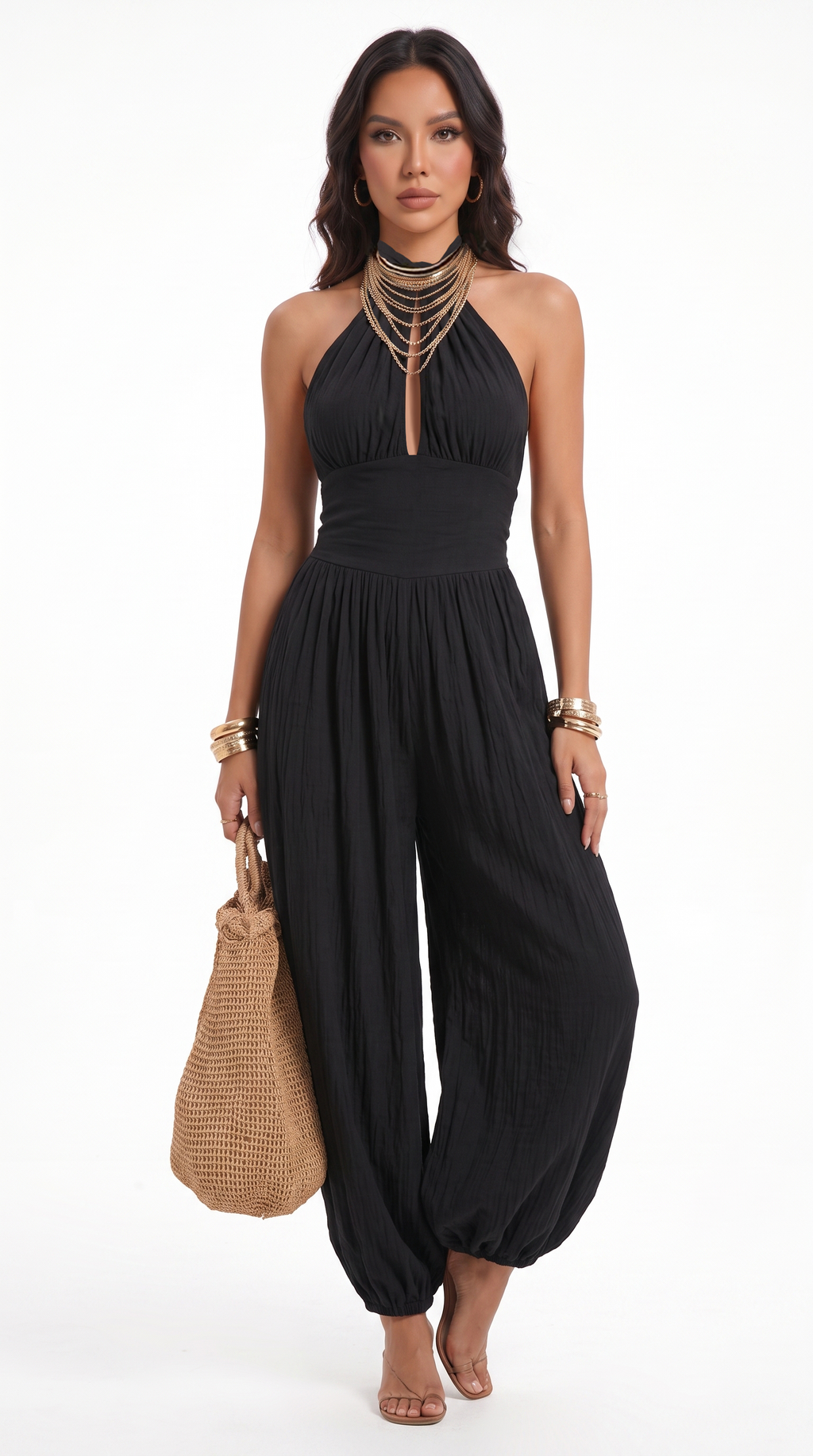 Woman wearing a black halter jumpsuit with a white background, from Meleche Fashion USA or Meléche (short as (Mé))