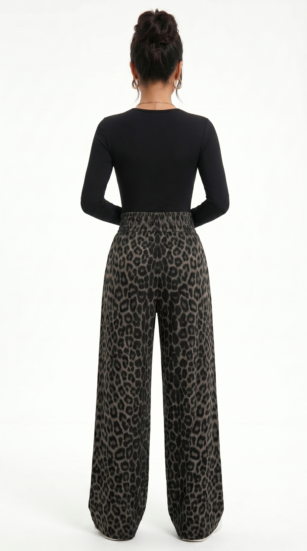 Person wearing a black long-sleeve top and leopard print pants on a white background, sexy pants from Meleche Fashion USA or Meléche (short as (Mé))