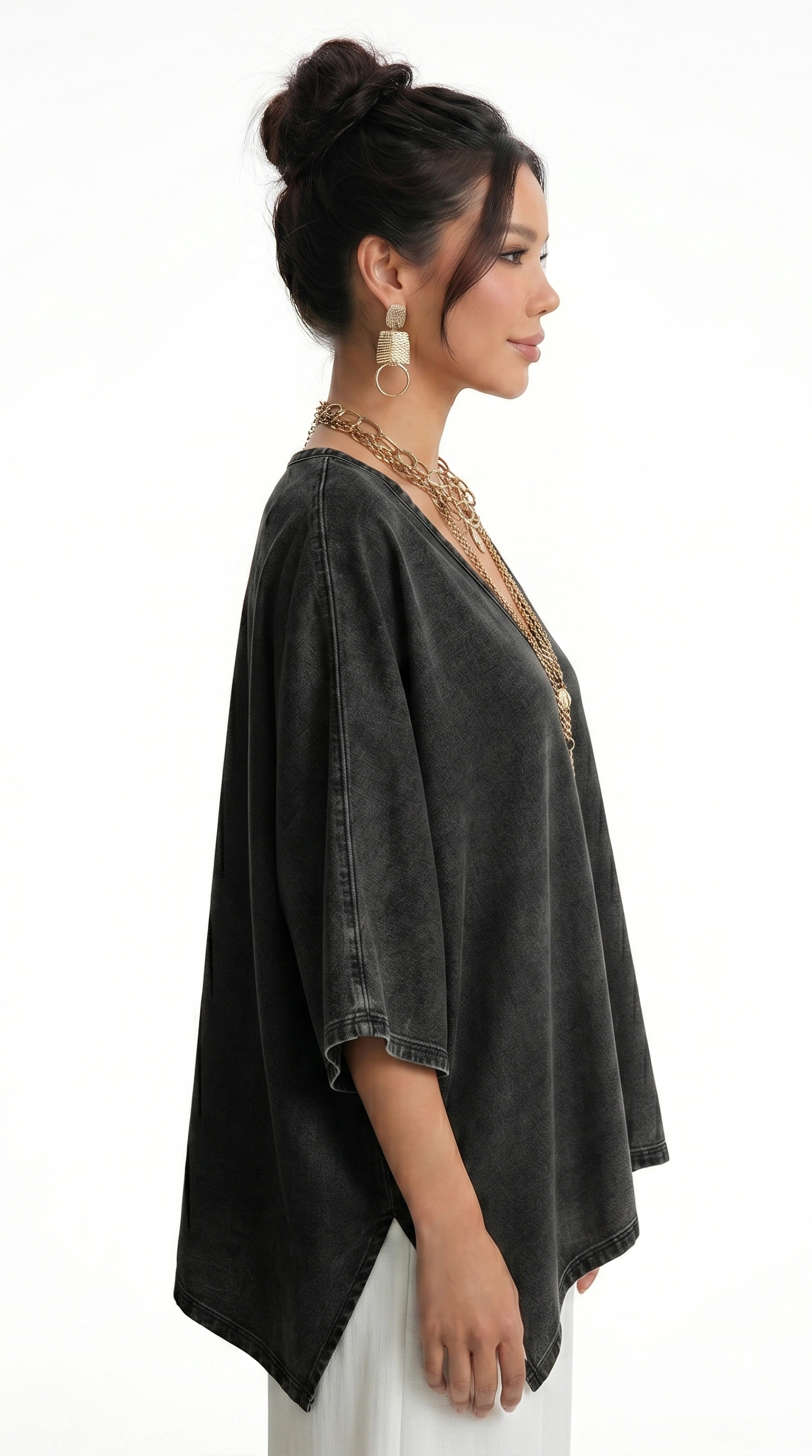 Woman wearing a black kimono-style garment with gold accents on a white background, from Meleche Fashion USA or Meléche (short as (Mé))