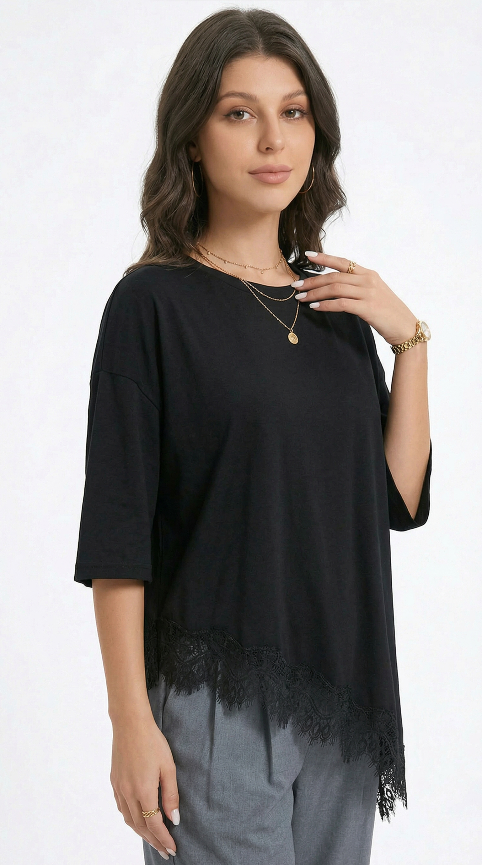Woman wearing a black lace top with long sleeves on a white background from Meleche or Meléche (short as (Mé))
