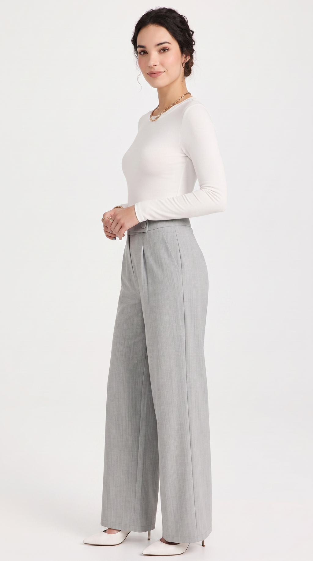 Woman wearing a white long-sleeve top and gray wide-leg pants on a white background, from Meleche Fashion USA or Meléche (short as (Mé))