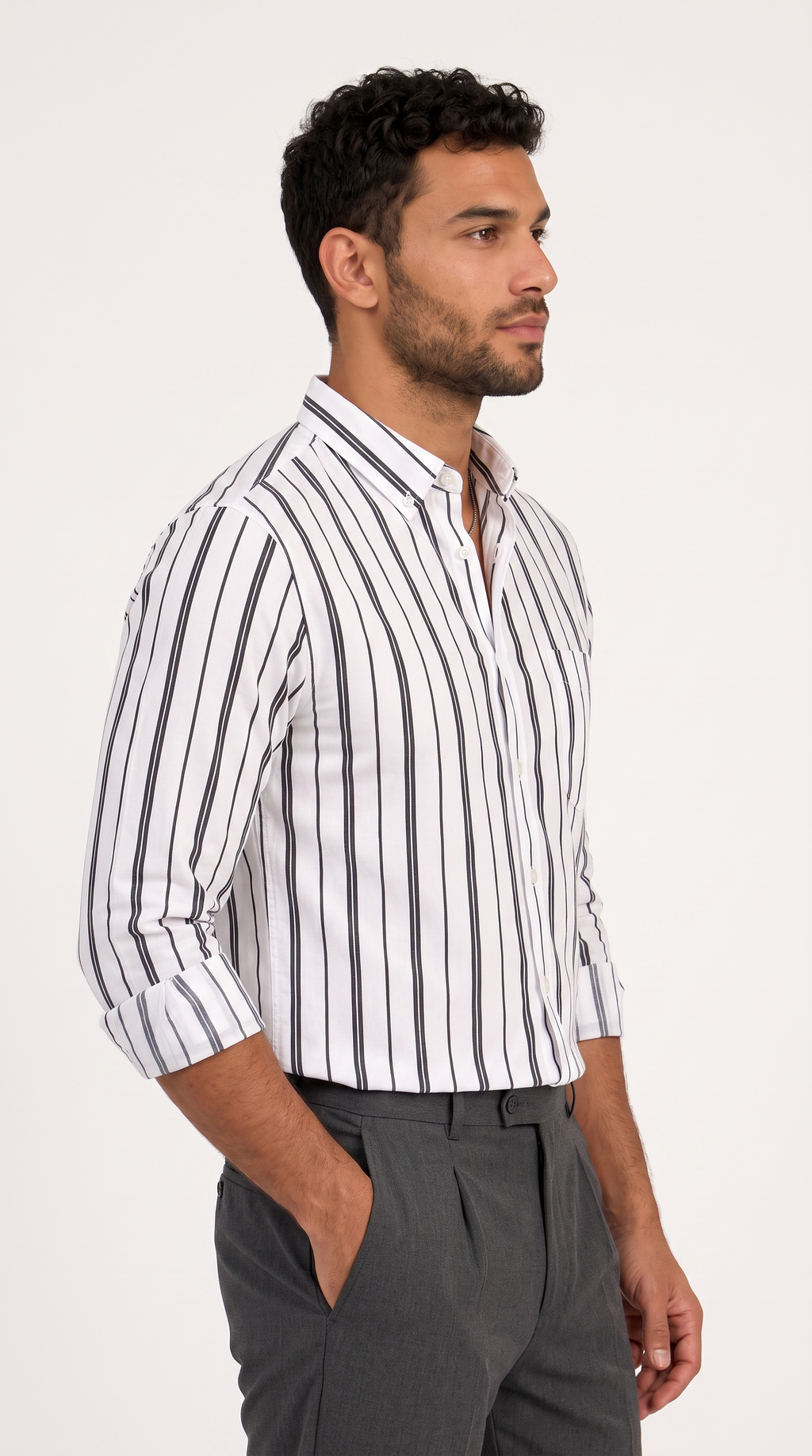 A man wearing a white long-sleeve button-down shirt with vertical gray stripes, paired with dark gray trousers, shown in a side-profile view against a plain white background, from Meleche Fashion USA or Meléche (short as (Mé))