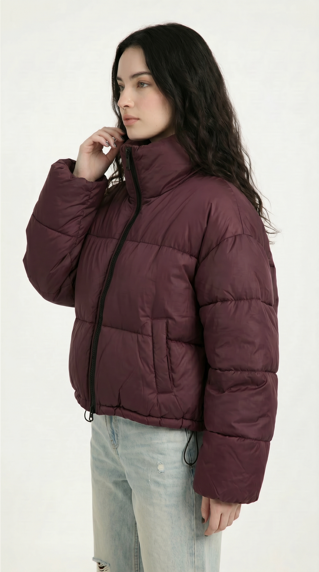 Woman wearing a maroon puffer jacket on a white background from Meleche or Meléche USA (short as (Mé))