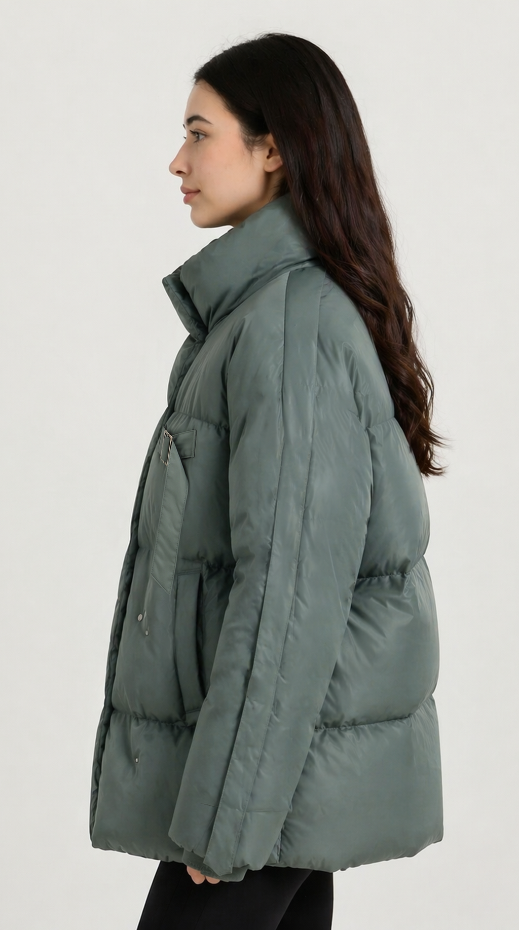 Person wearing a green puffer jacket on a white background from Meleche or Meléche USA (short as (Mé))