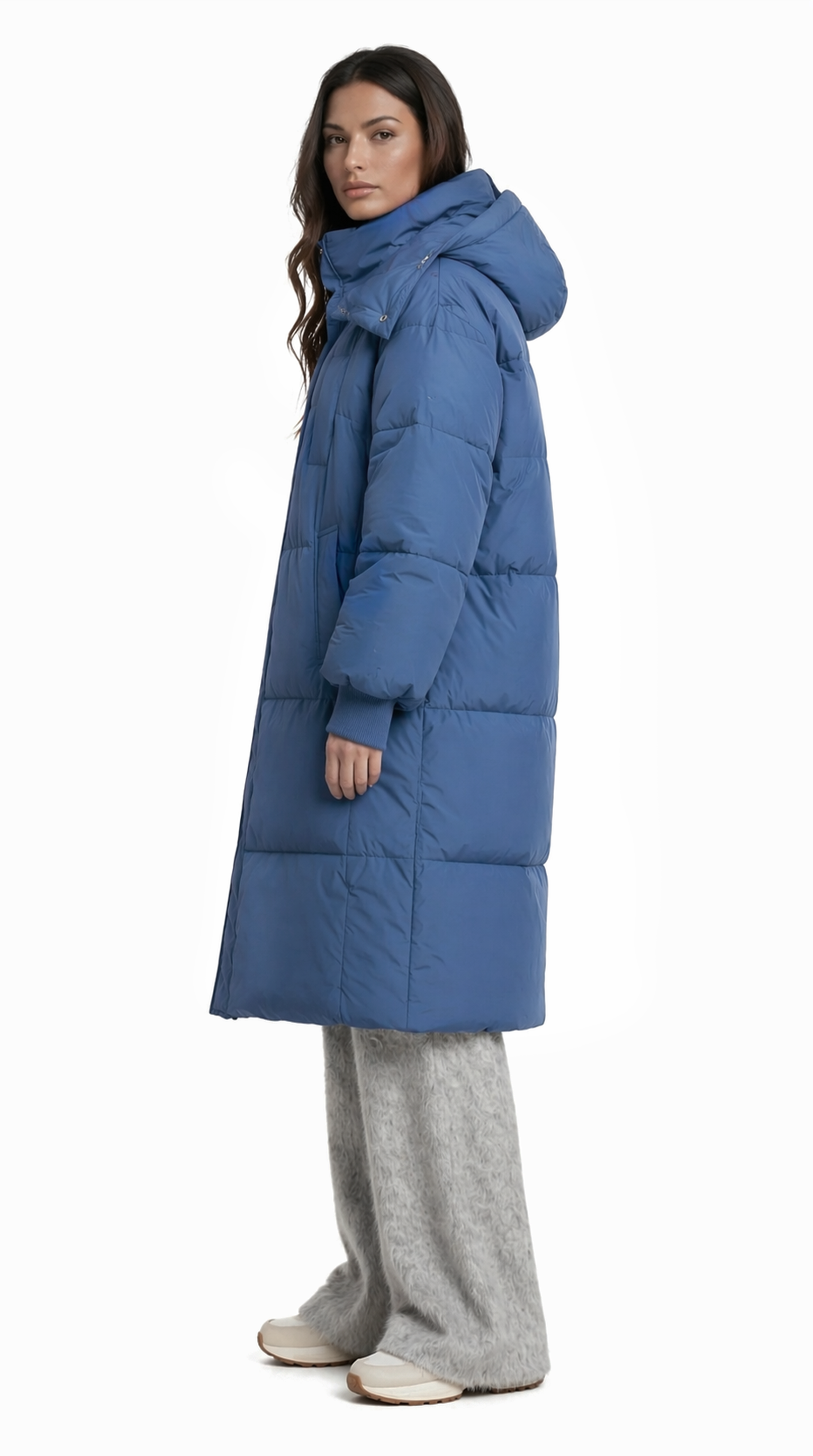 Woman wearing a blue puffer coat on a white background from Meleche Fashion USA or Meléche (short as (Mé))